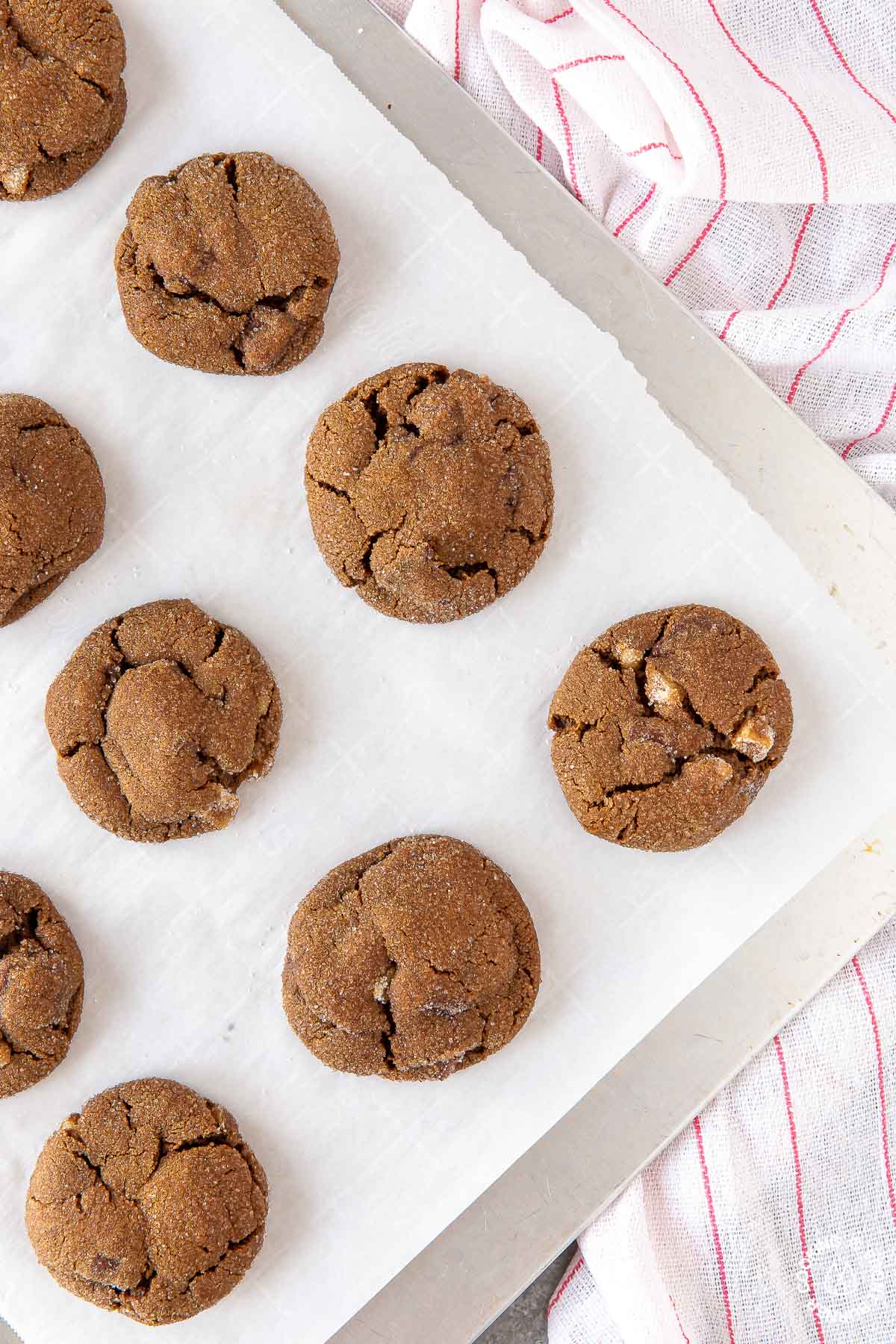 a cookie sheet with baked triple ginger chocolate cookies