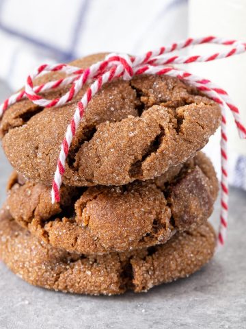 3 triple ginger cookies stacked and tied with a red cord