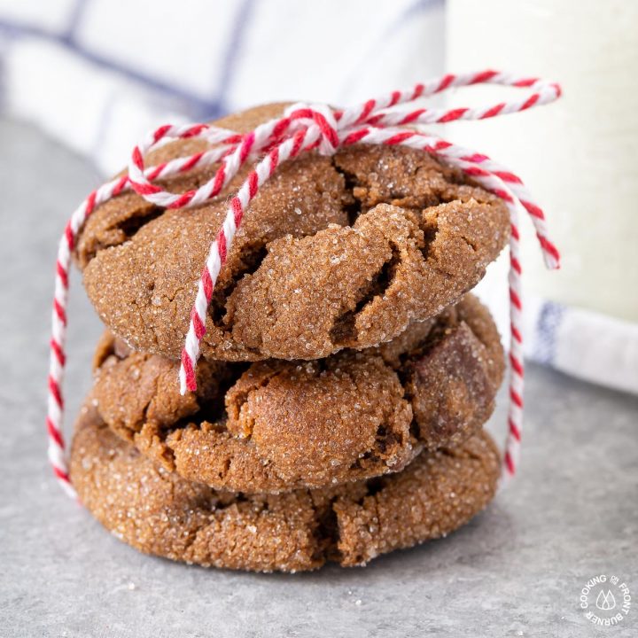 3 triple ginger cookies stacked and tied with a red cord