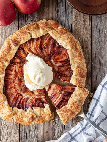 apple galette on a board with ice cream on top