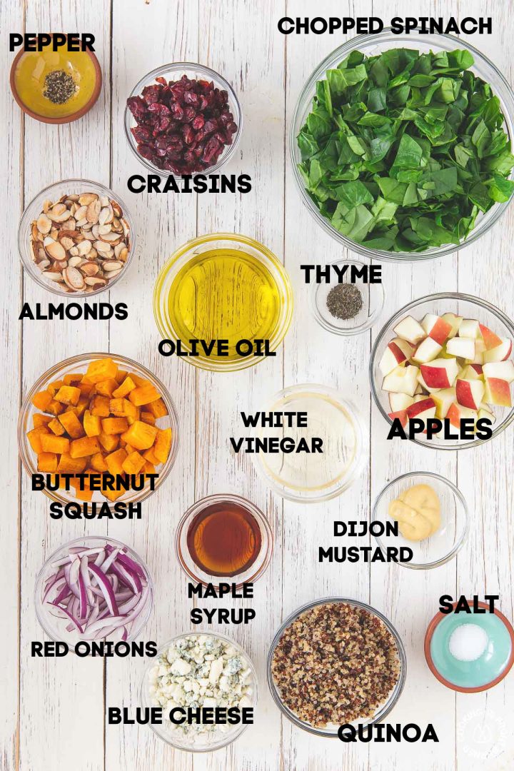 ingredients for fall chopped salad in bowls on a board