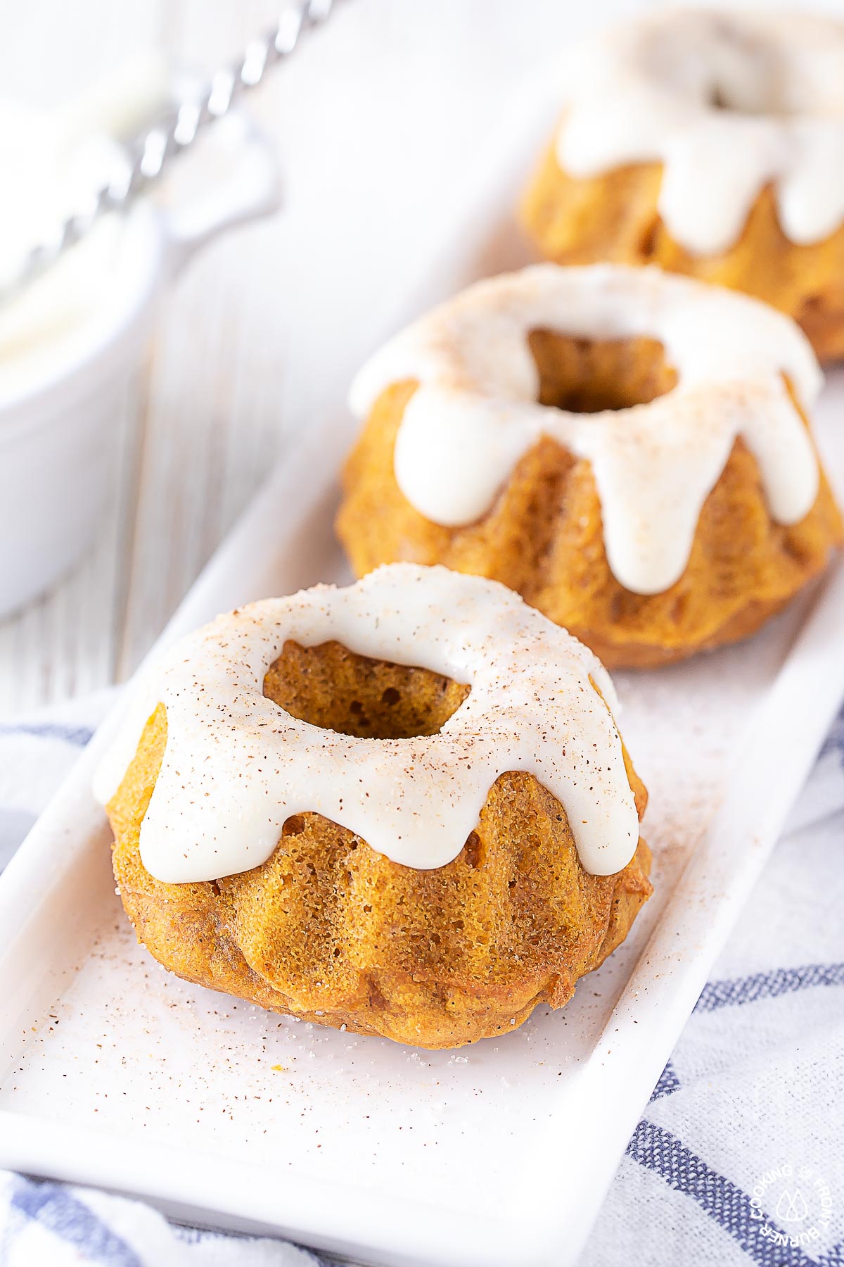 mini pumpkin spice bundt cake on a white plate