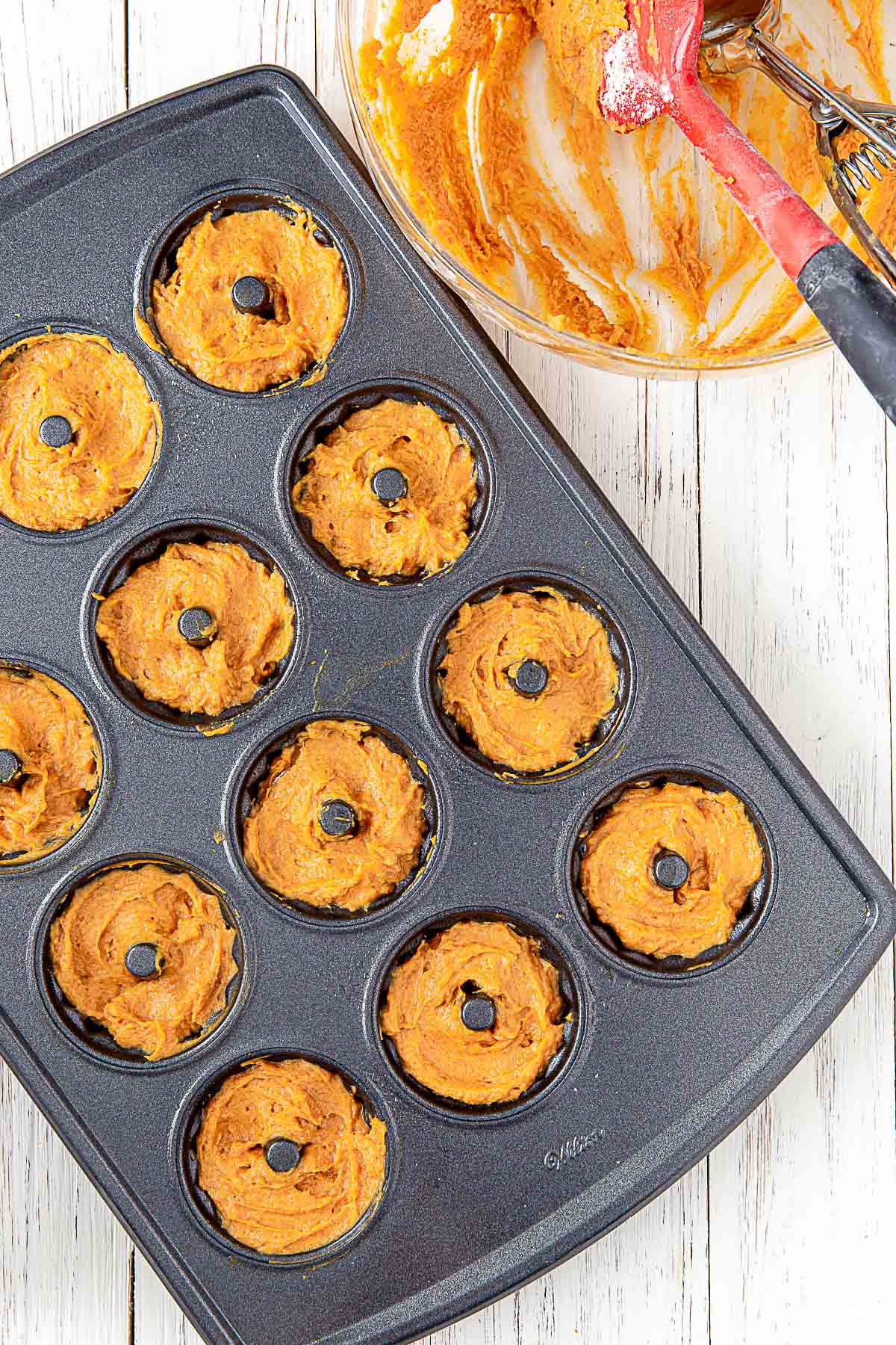 pumpkin batter in mini bundt cake pan