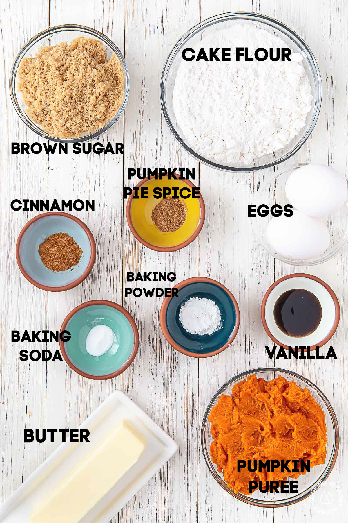 cake flour, brown sugar, eggs, cinnamon, pumpkin pie spice, baking soda, baking powder pumpkin puree butter in bowls