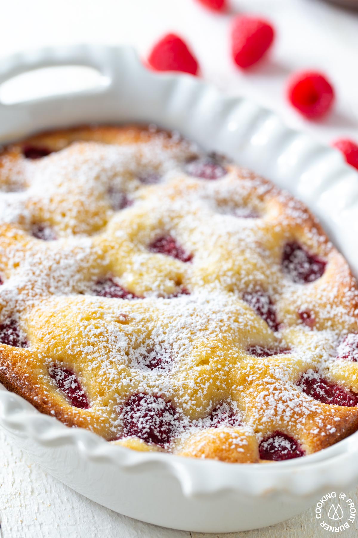 lemon raspberry buckle with powdered sugar on top