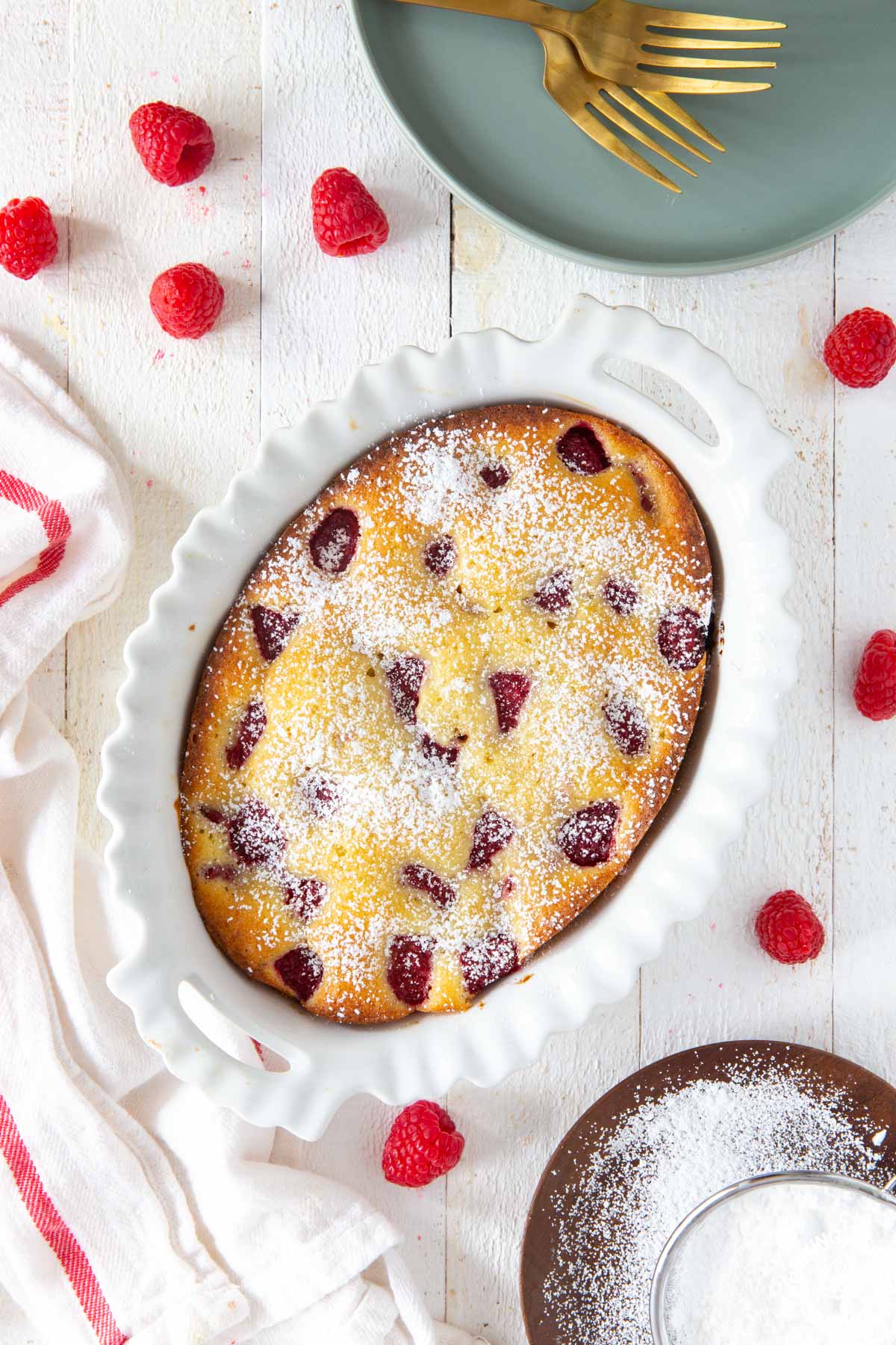 lemon raspberry buckle cake in a white baking dish