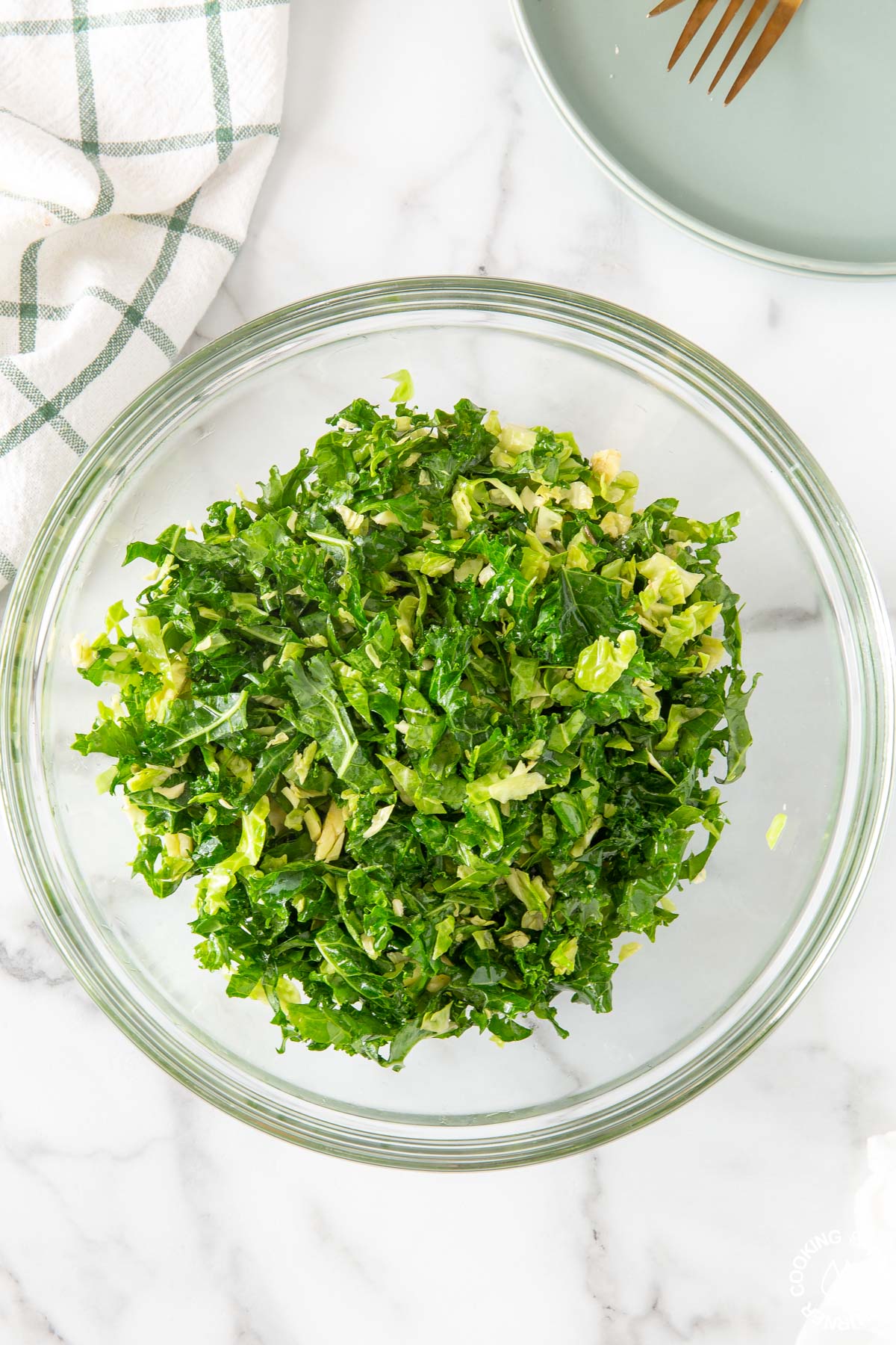 fresh kale in a bowl rubbed with olive oil