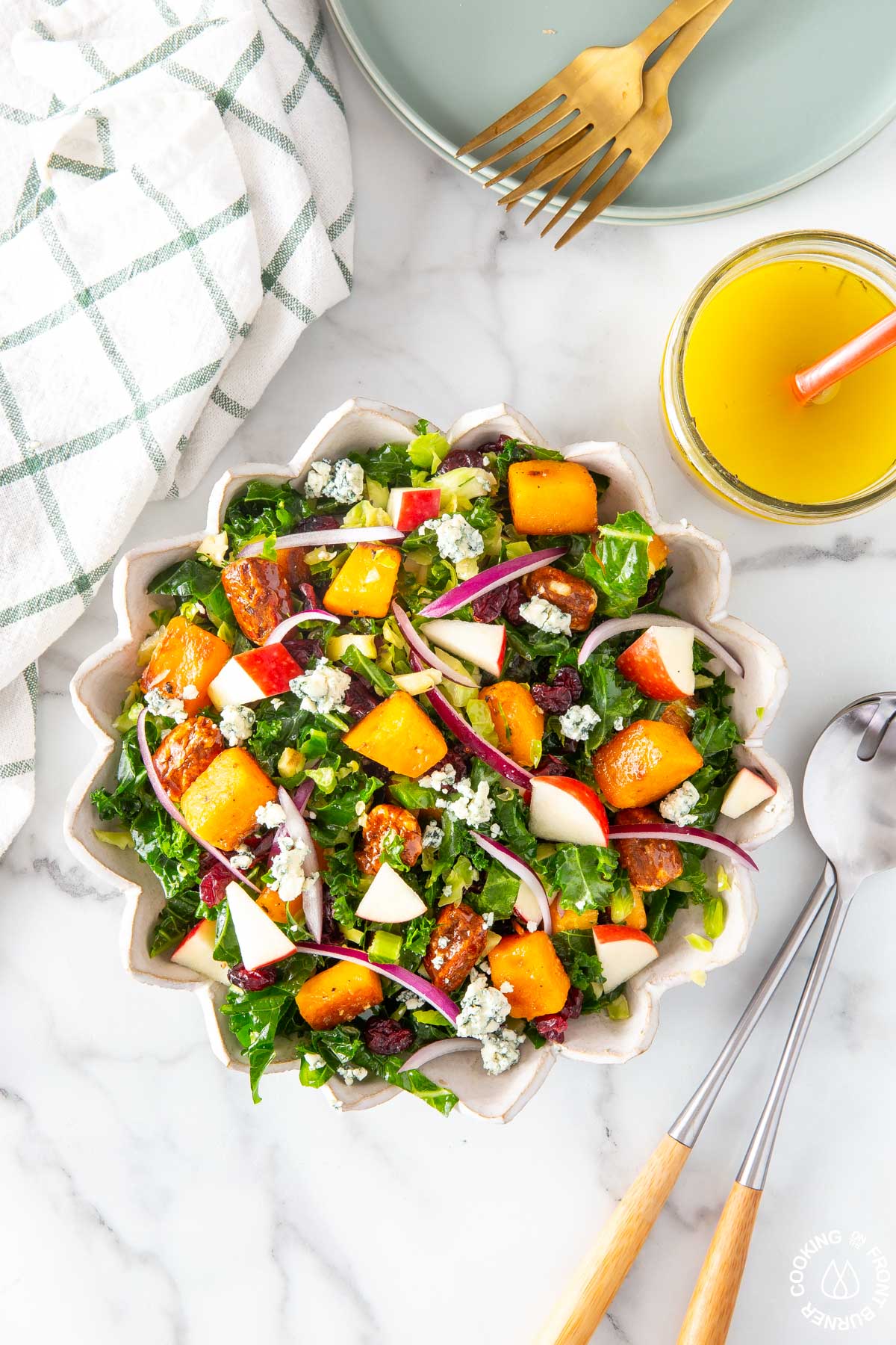 kale and brussels sprout salad in a white bowl