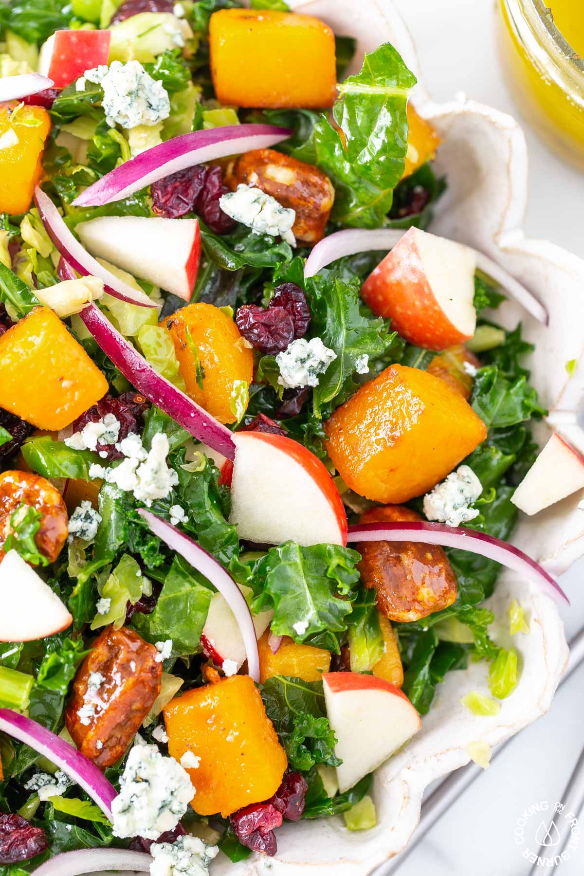 kale brussels sprout salad mixed in a bowl