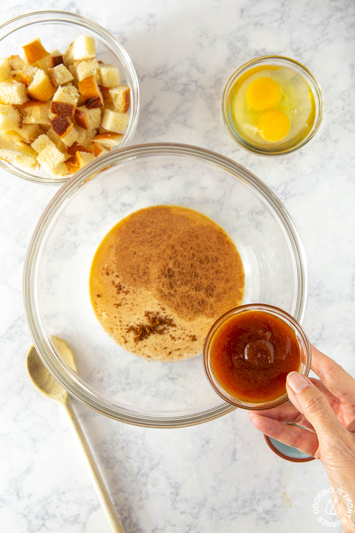 bowl with milk spices and adding pumpkin butter