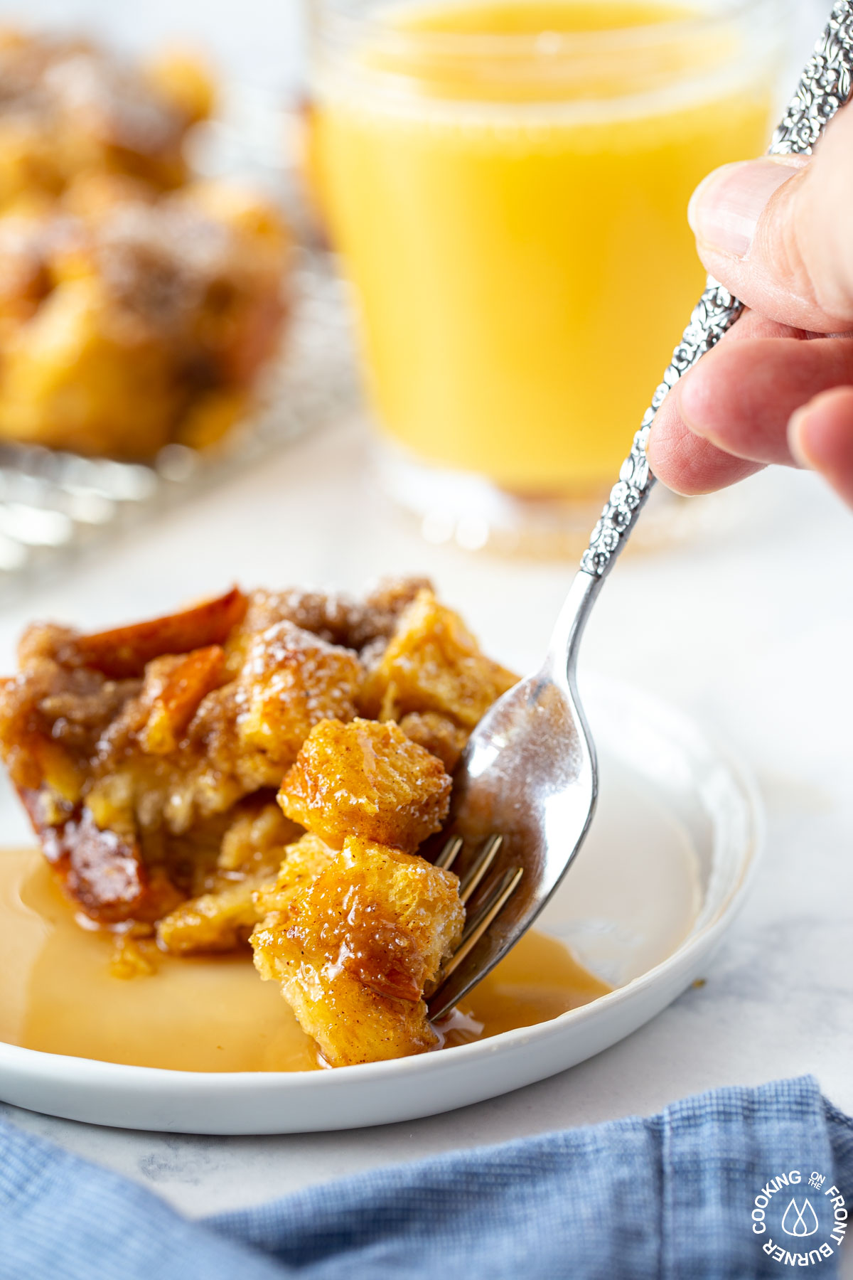 using a fork to take a bite of pumpkin muffin french toast