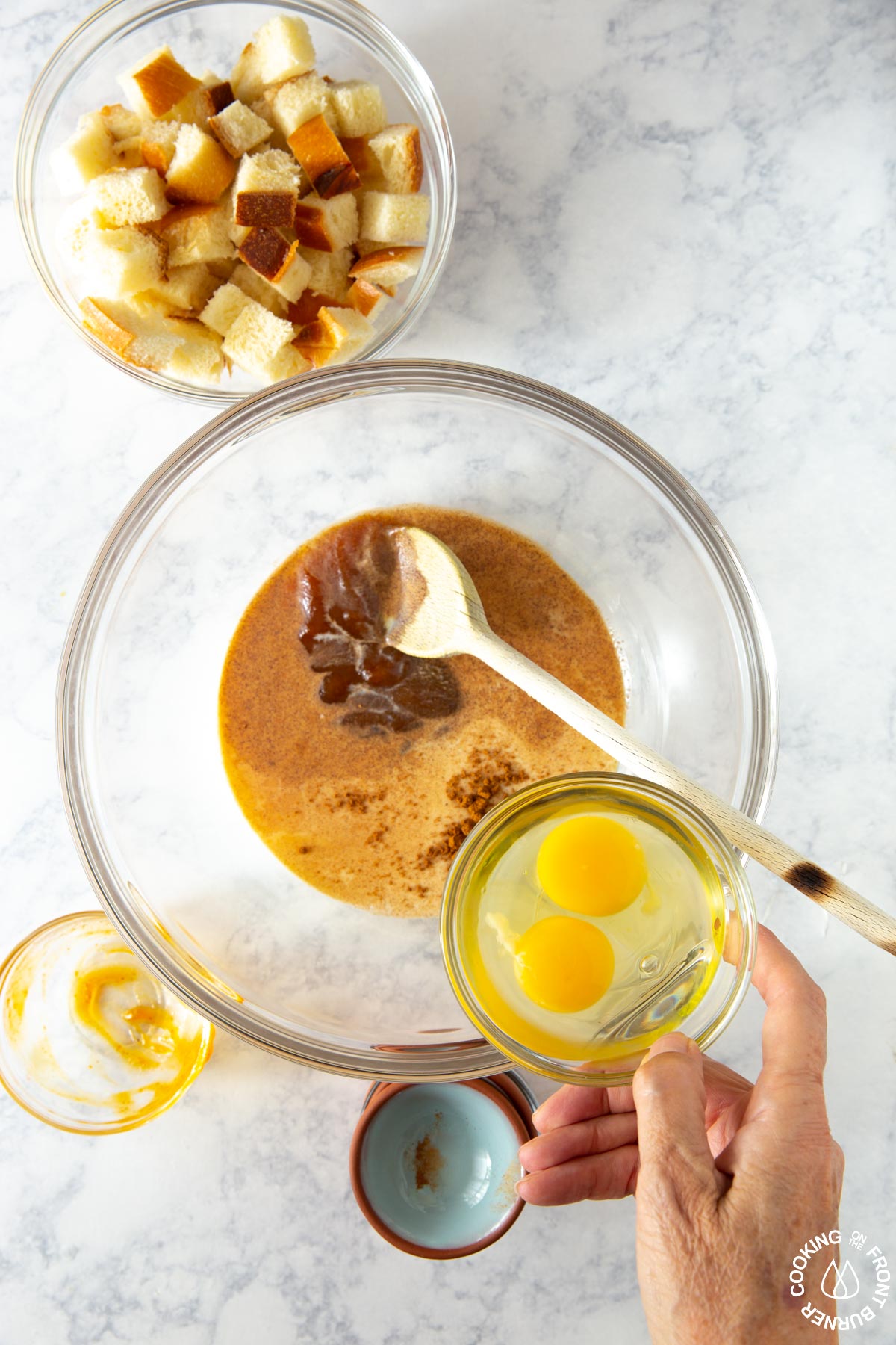 adding eggs to a pumpkin milk mixture