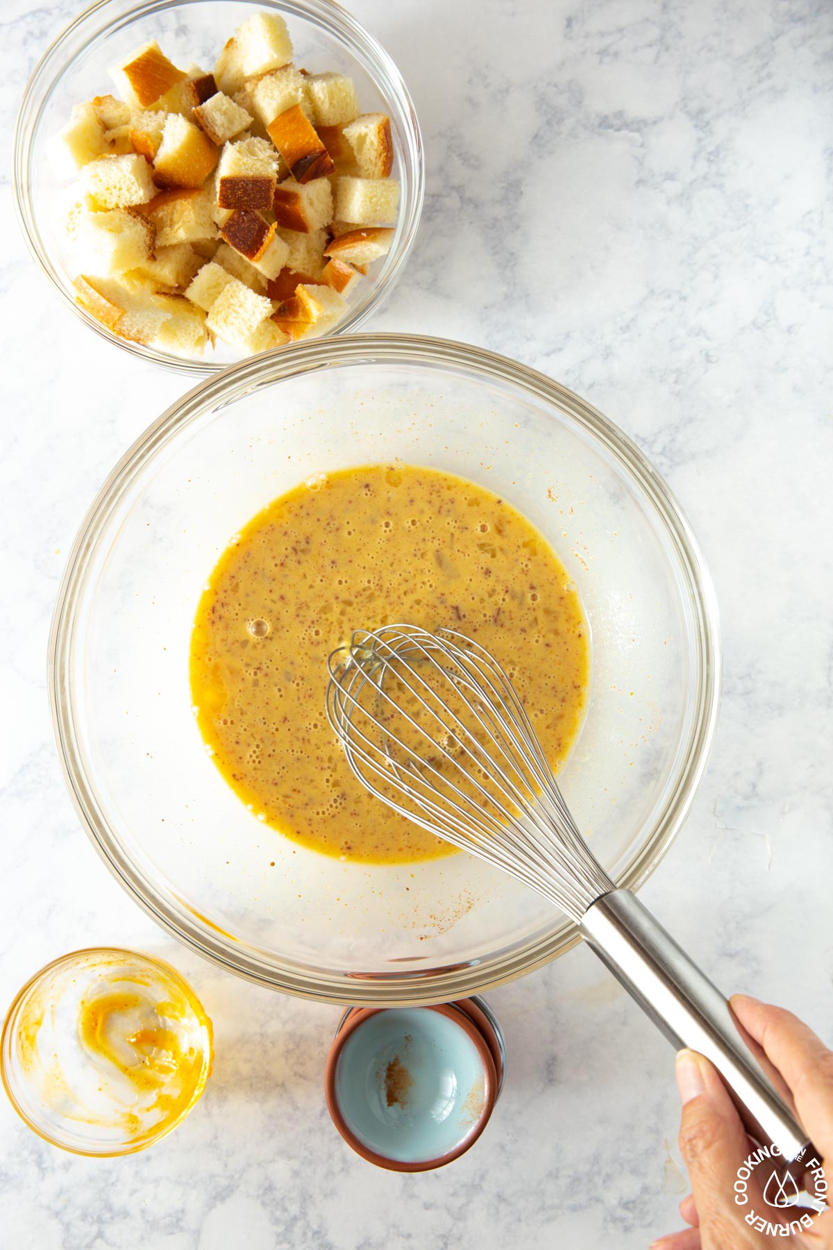 a bowl with pumpkin mixture being whisked