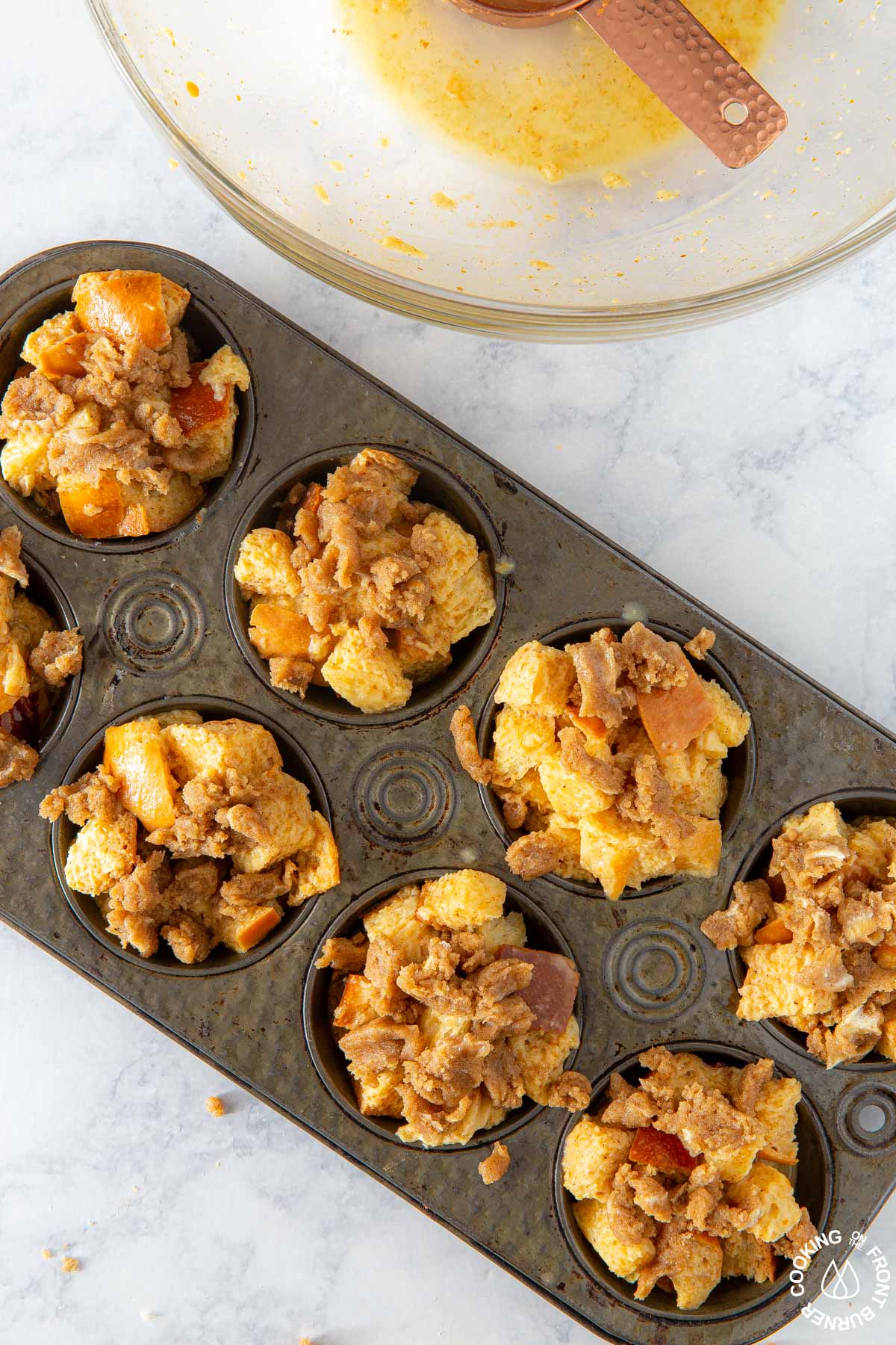 pumpkin butter french toast cubes in a muffin pan