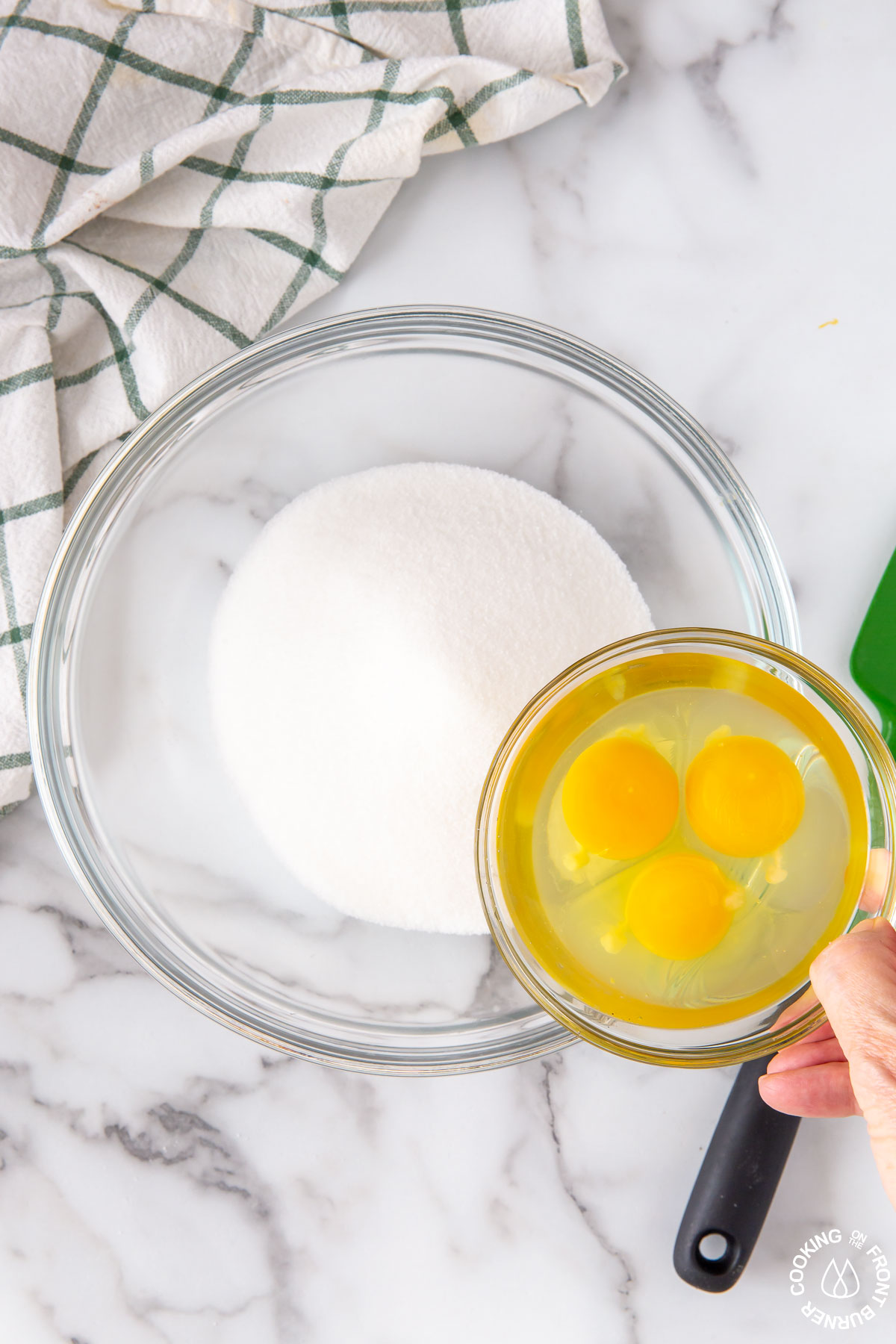 clear bowl with sugar and eggs