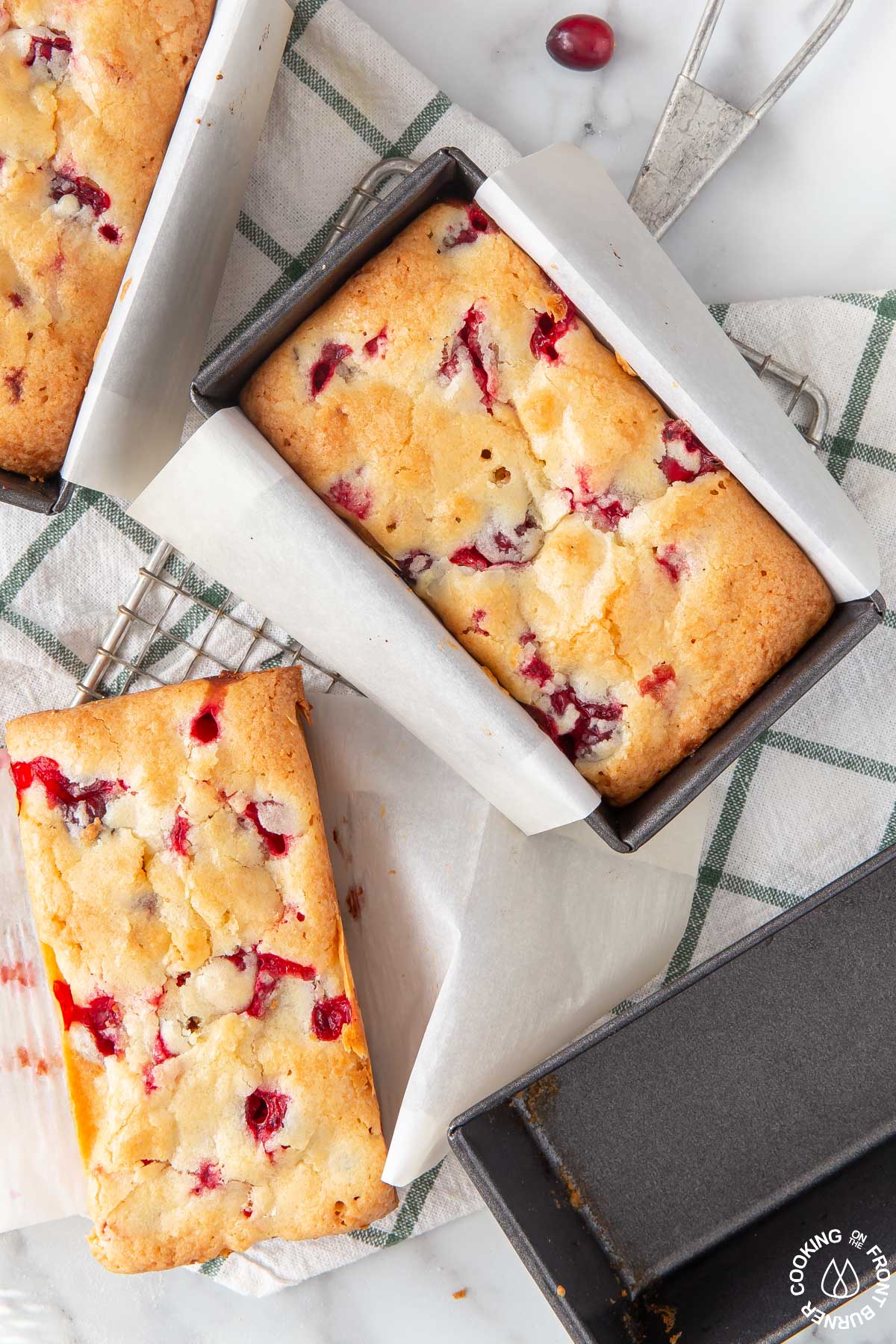 3 mini cranberry loaves on a cloth