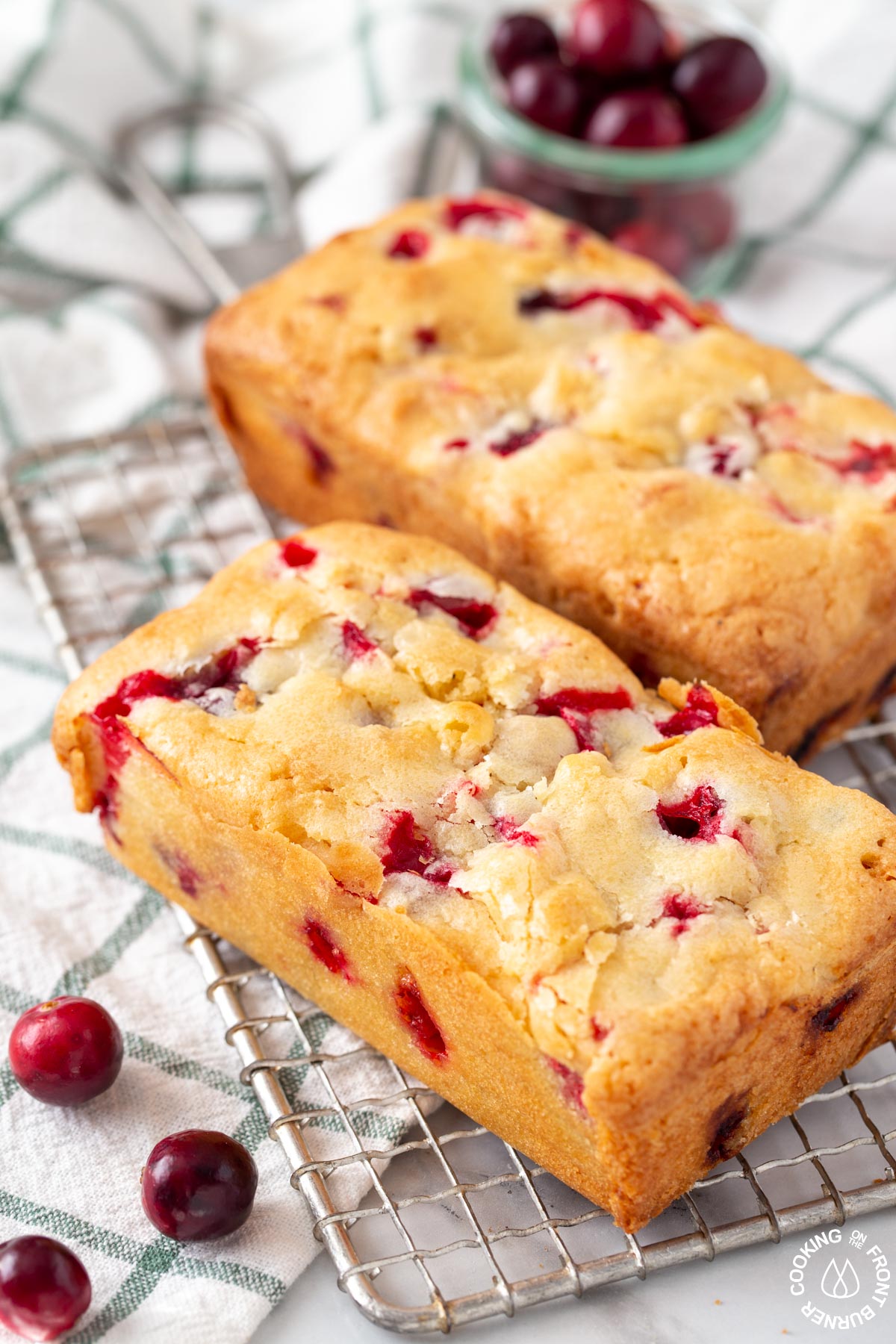 2 baked cranberry loaves on a wire rack