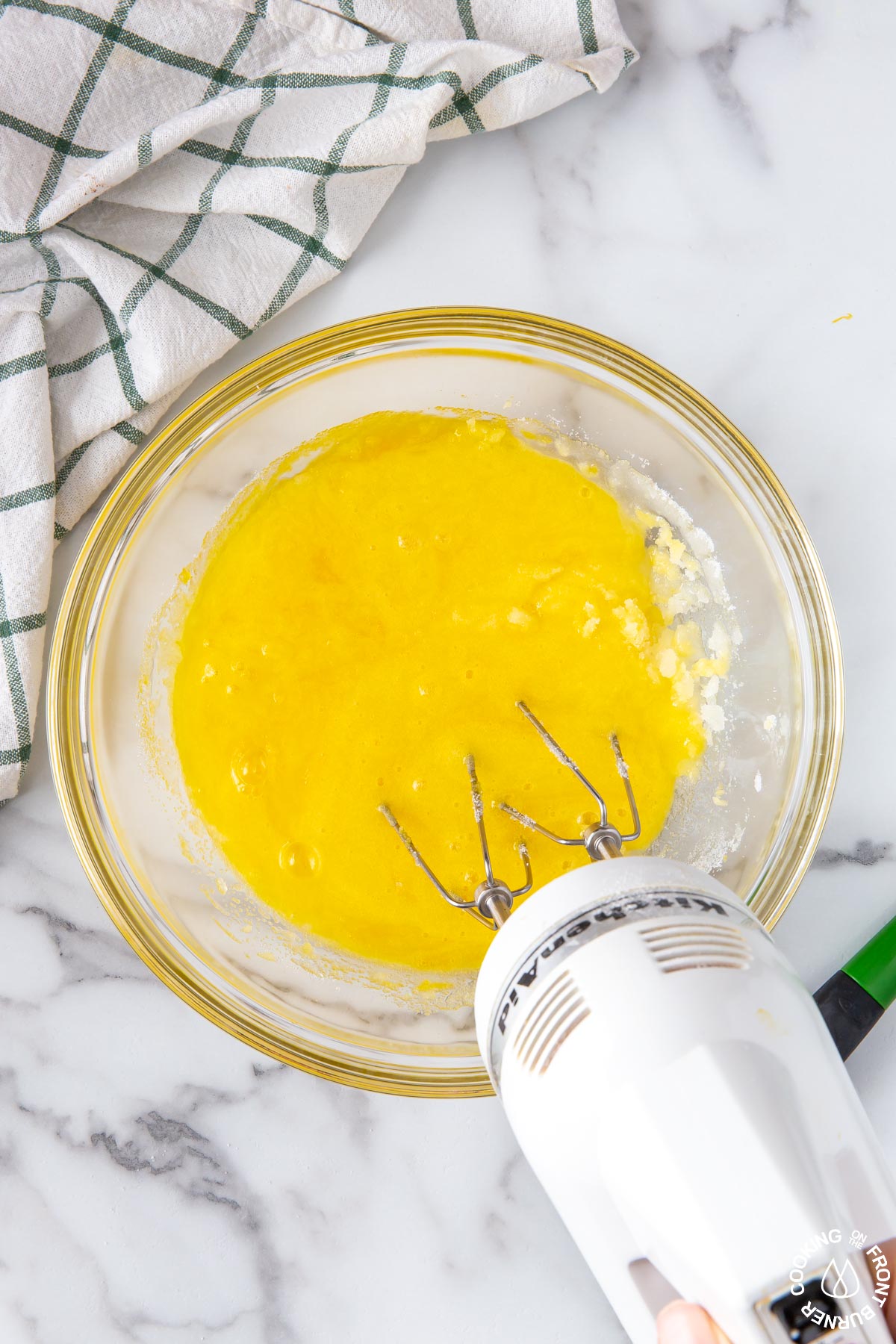 a bowl beating sugar and eggs