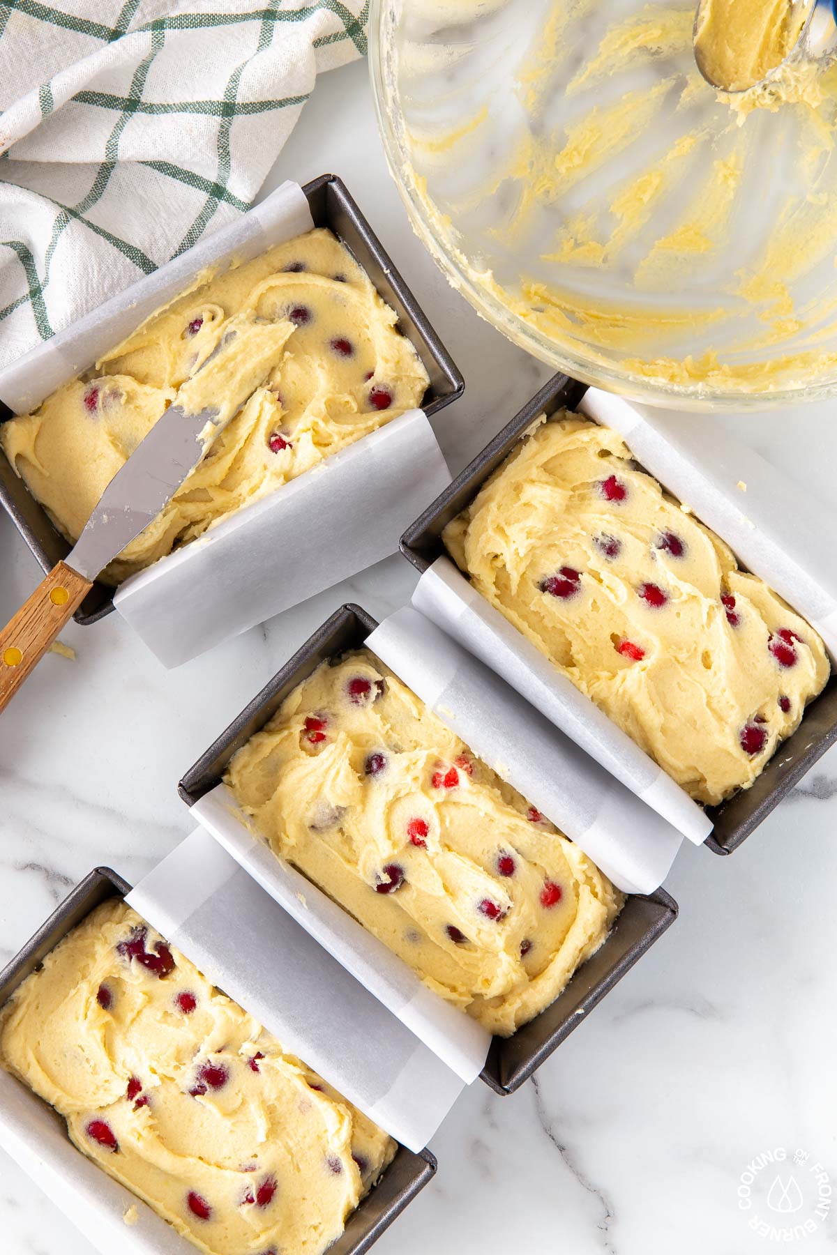 cranberry bread batter in mini loaf pans