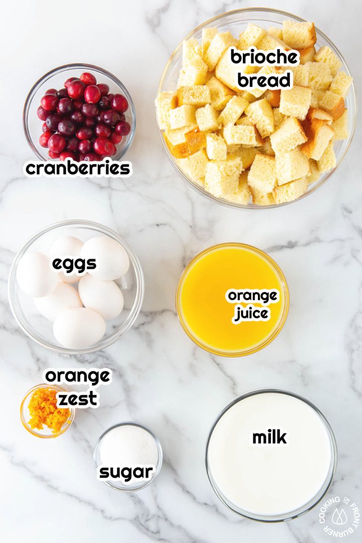 bowls of fresh cranberries, eggs, orange zest, OJ, milk and bread cubes