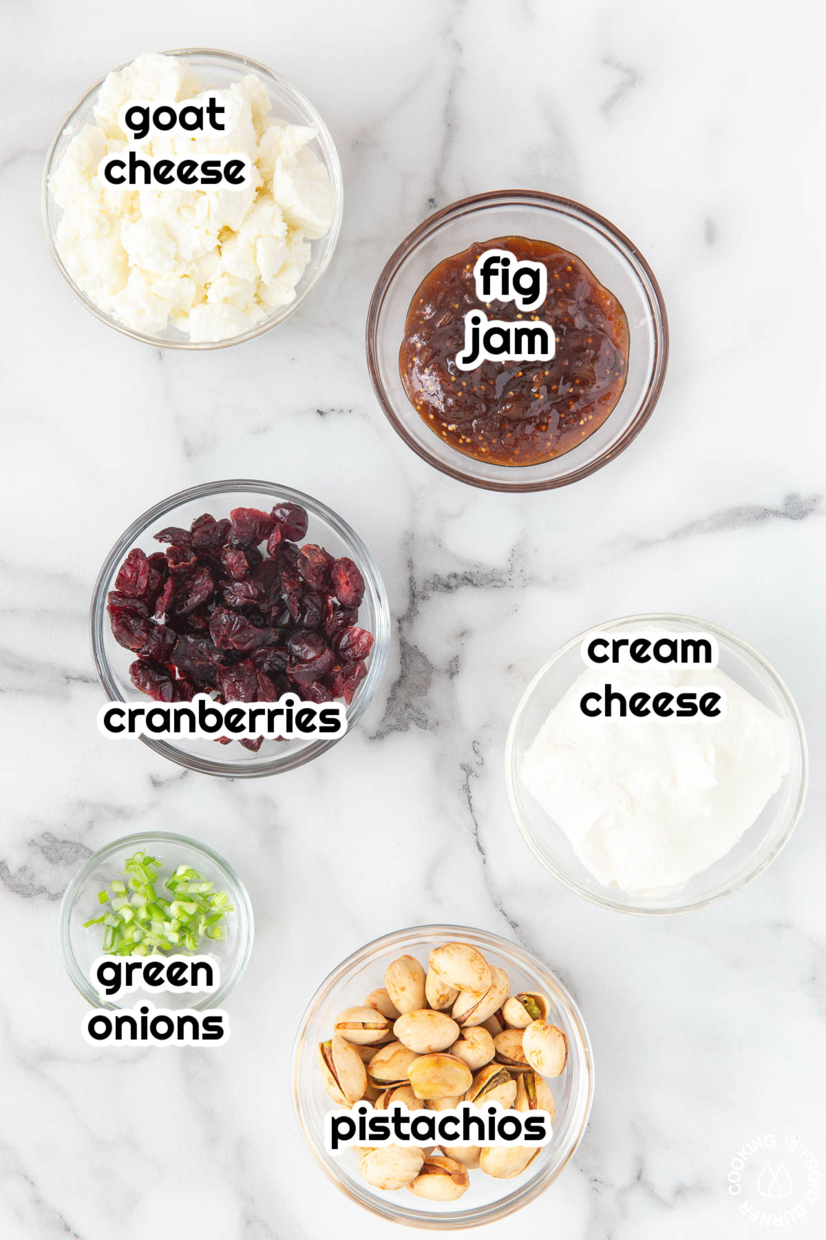 bowls with green onion, cranberries, goat cheese, cream cheese pistachios jam