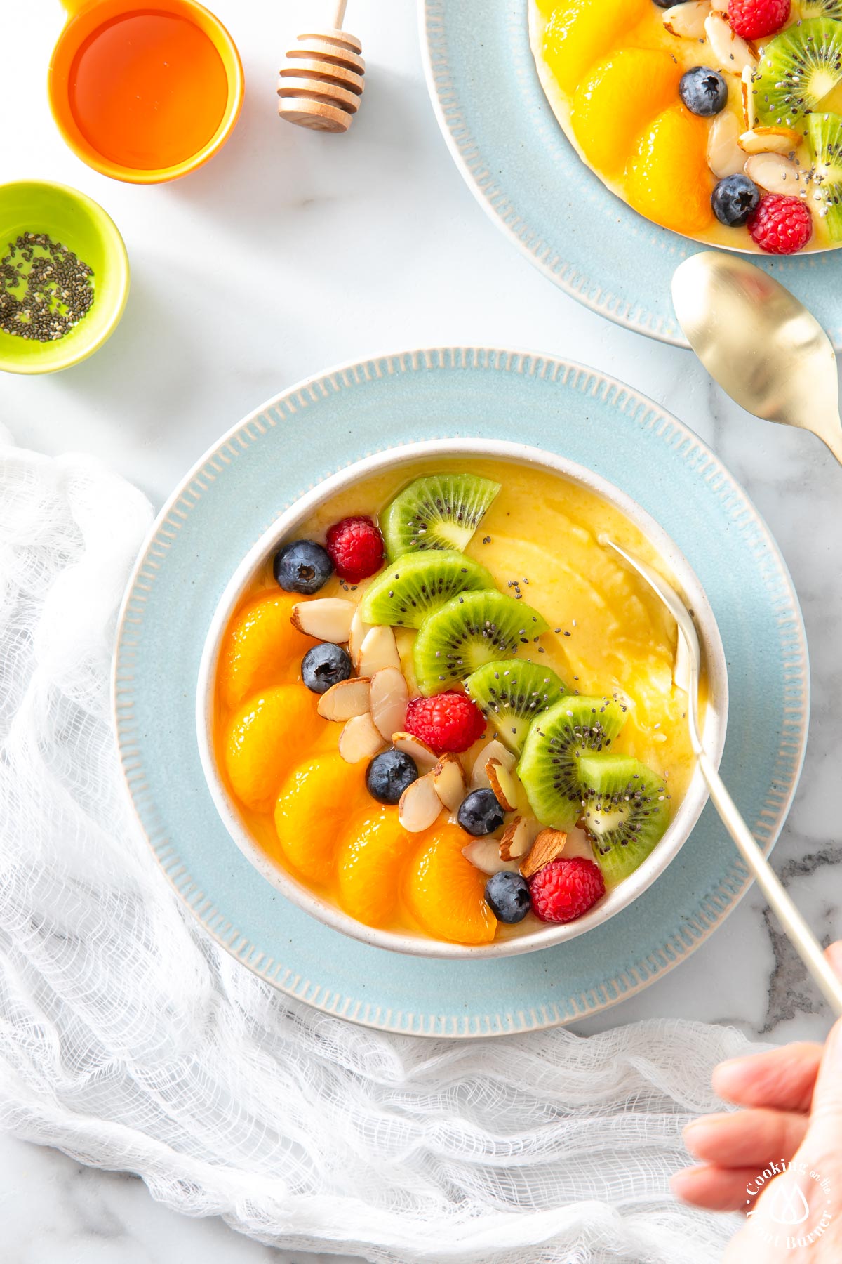 overhead bowl shot with smoothie and fruit on top