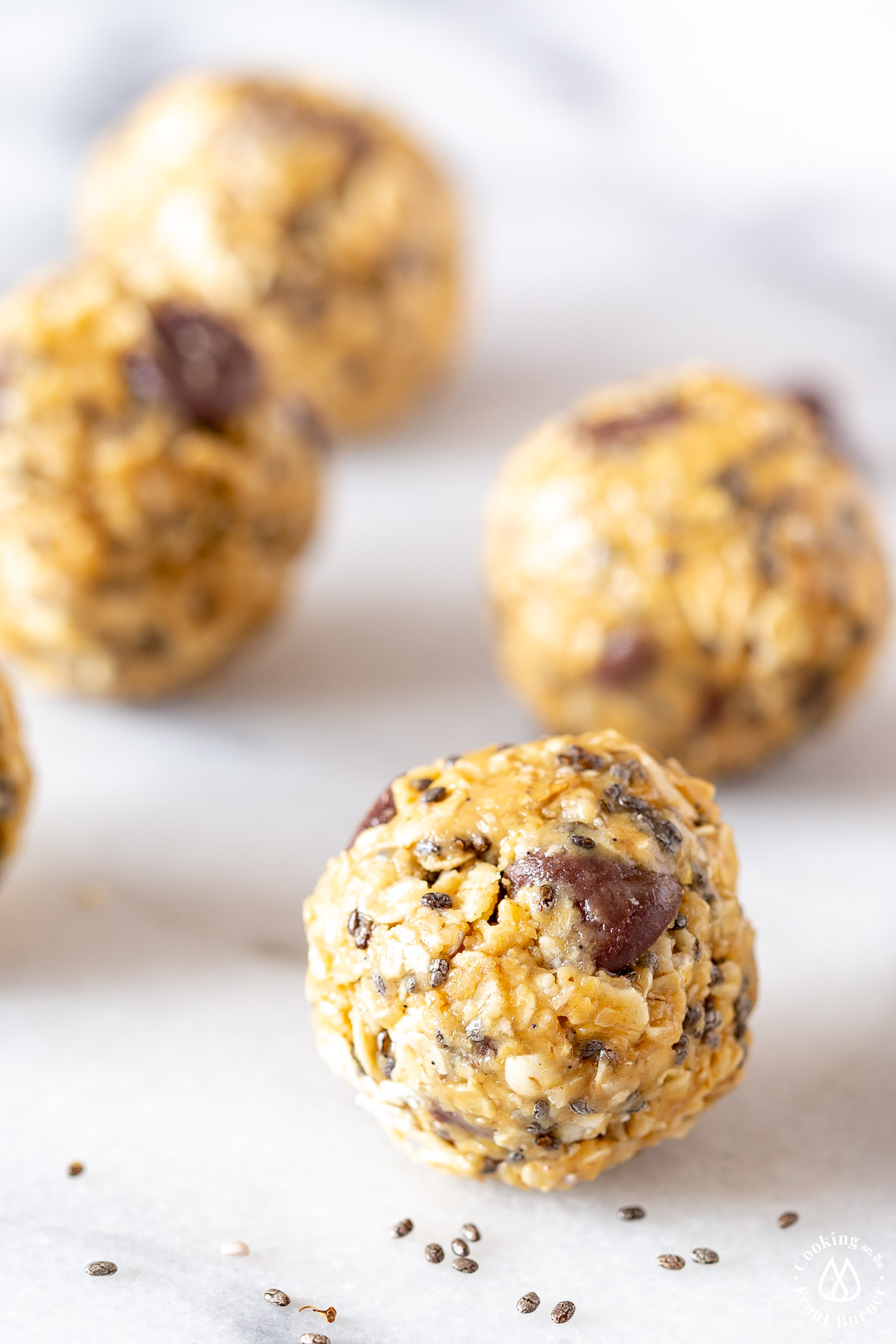 rolled energy bites on a marble board