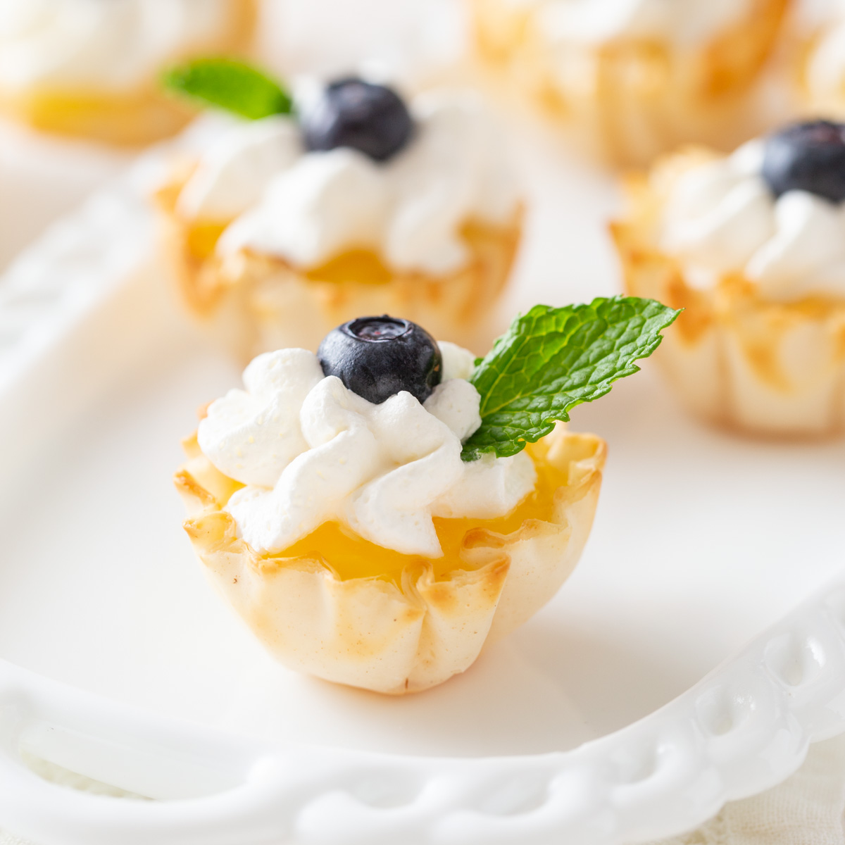 lemon tart on white plate