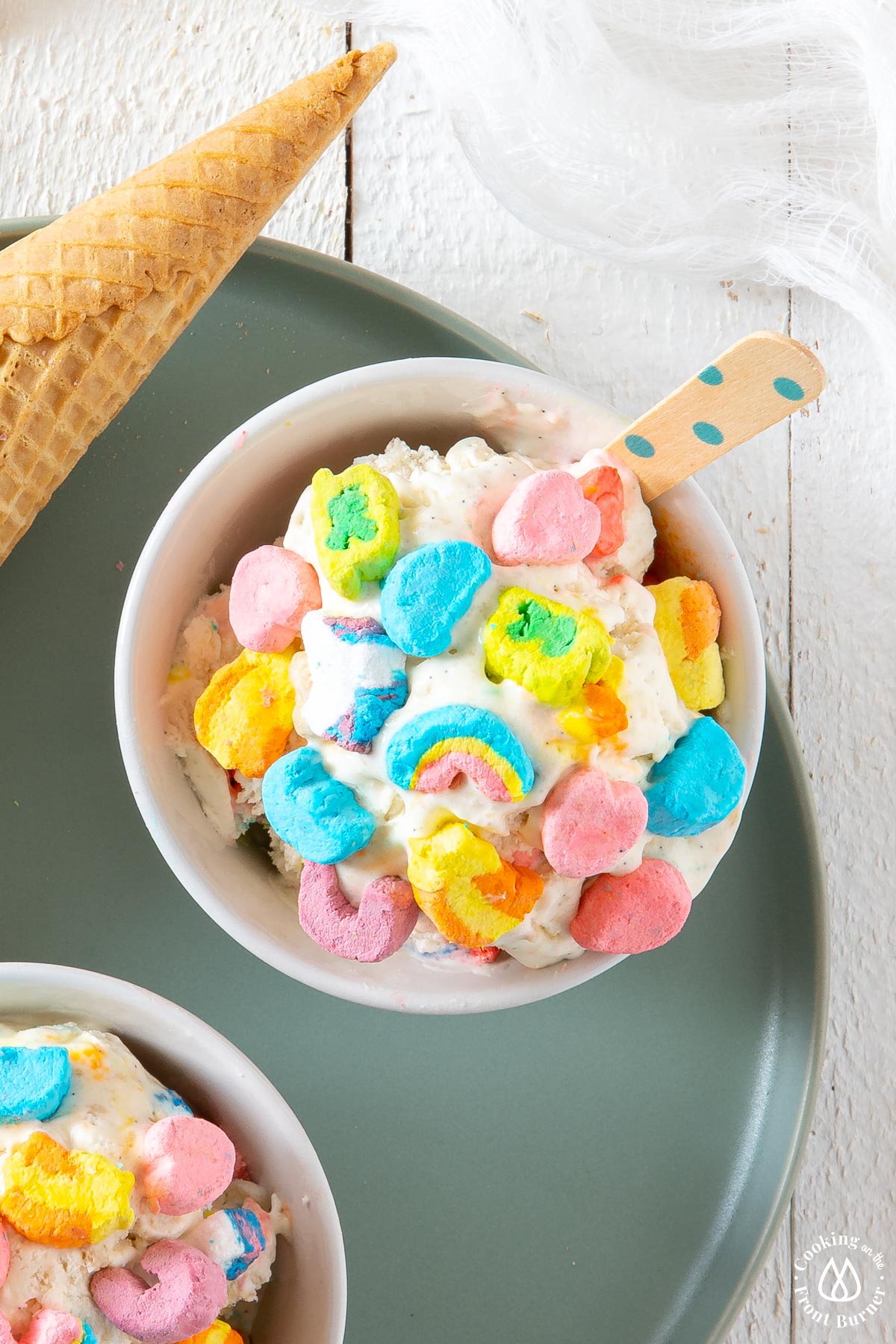 white bowl with ice cream topped with lucky charms