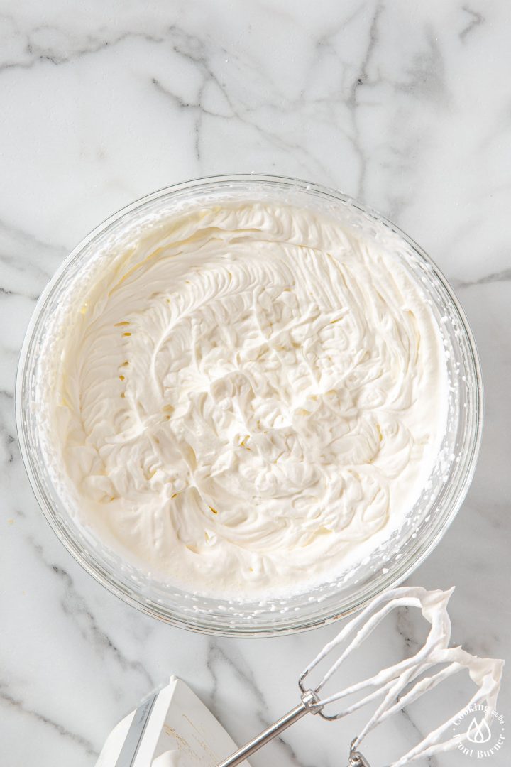 whipped cream in a clear bowl
