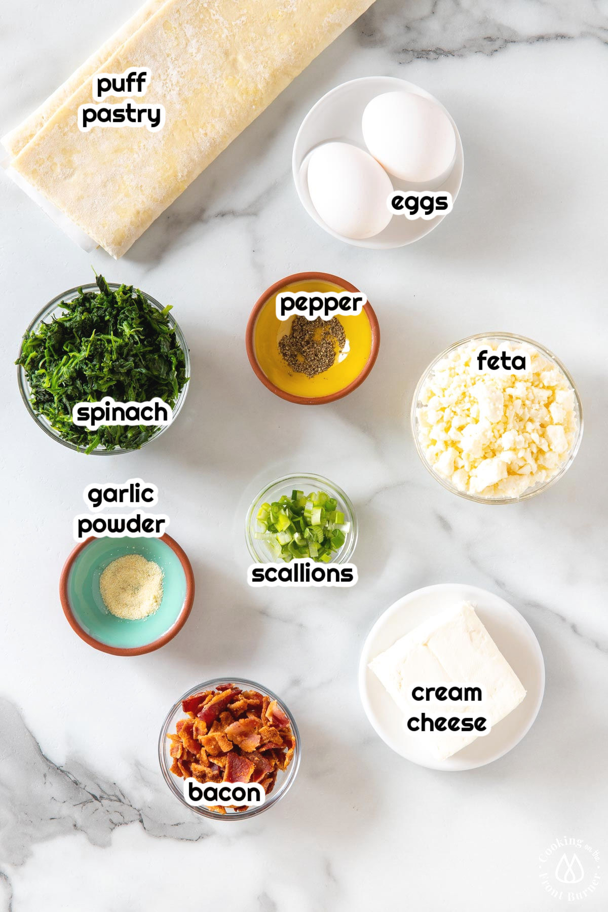 bowls with feta, spinach, cream chese, bacon, garlic powder, pepper and eggs