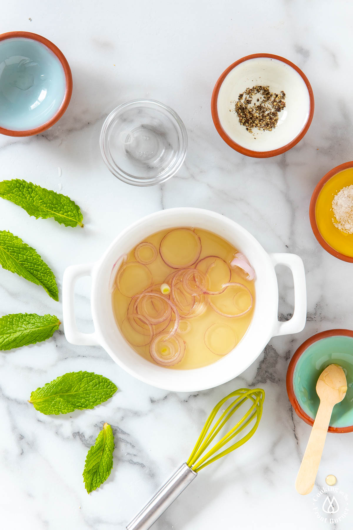 white bowl with shallots, honey and vinegar