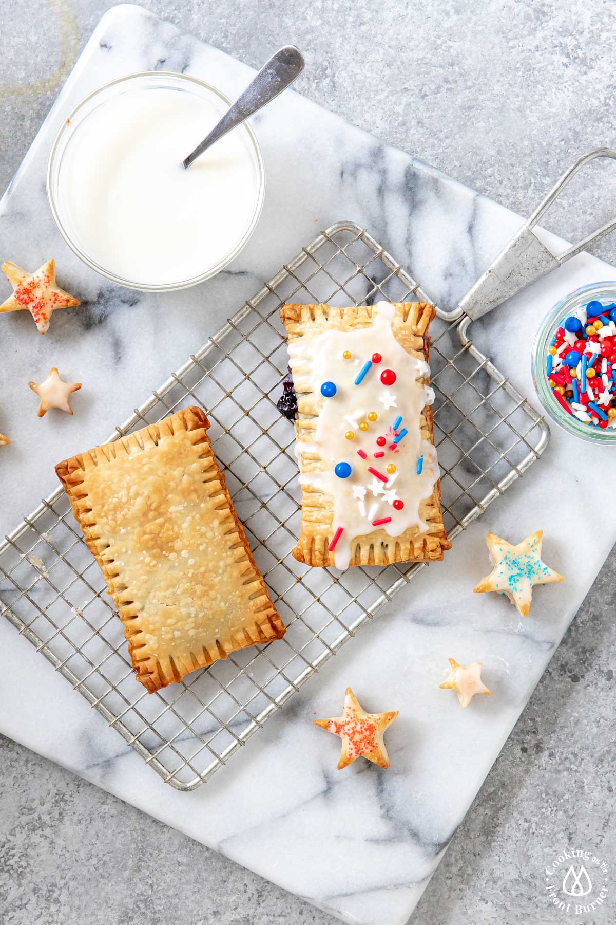 one frosted and one unfrosted pop tart on a wire rack