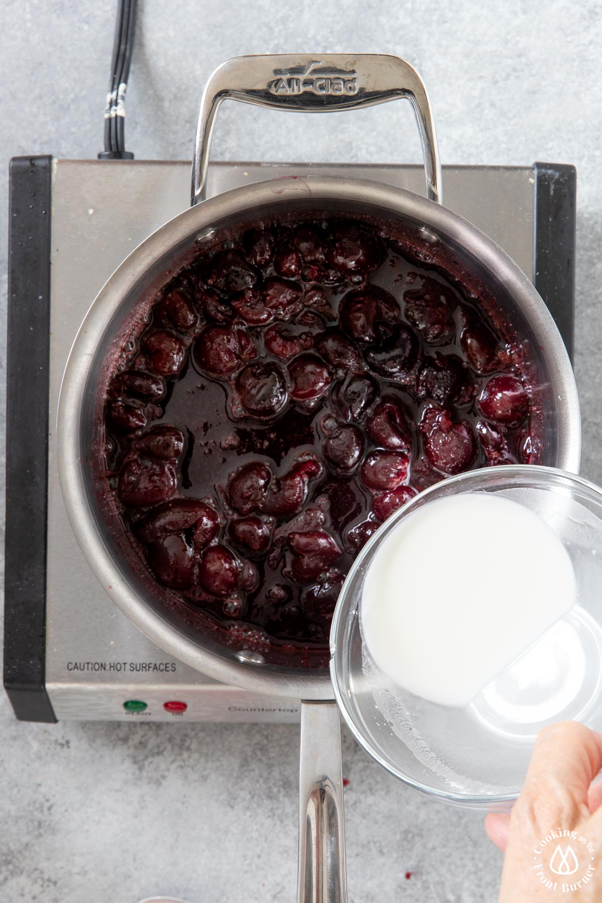 adding cornstarch to cherry mixture