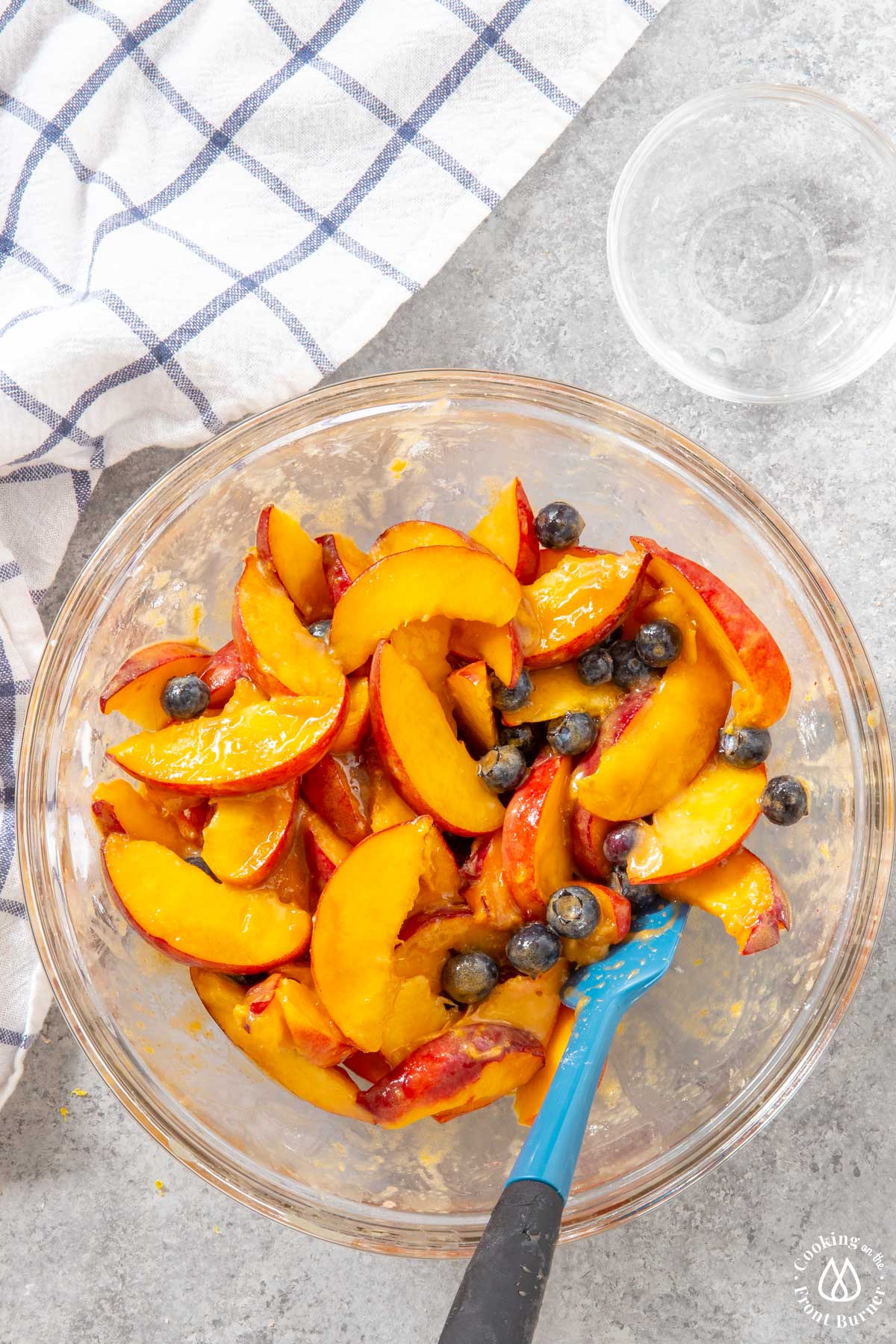 peaches and blueberries mixed with a brown sugar mixture