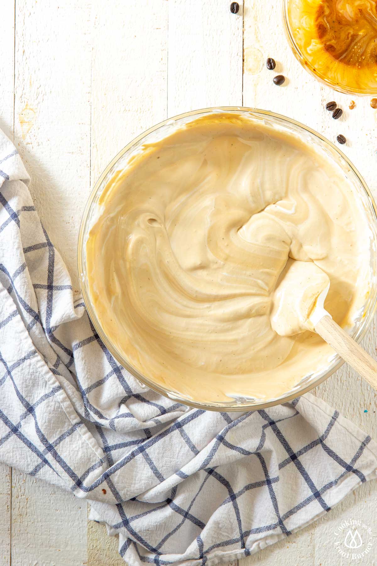 a mixture of heavy cream and coffee mixture in a bowl