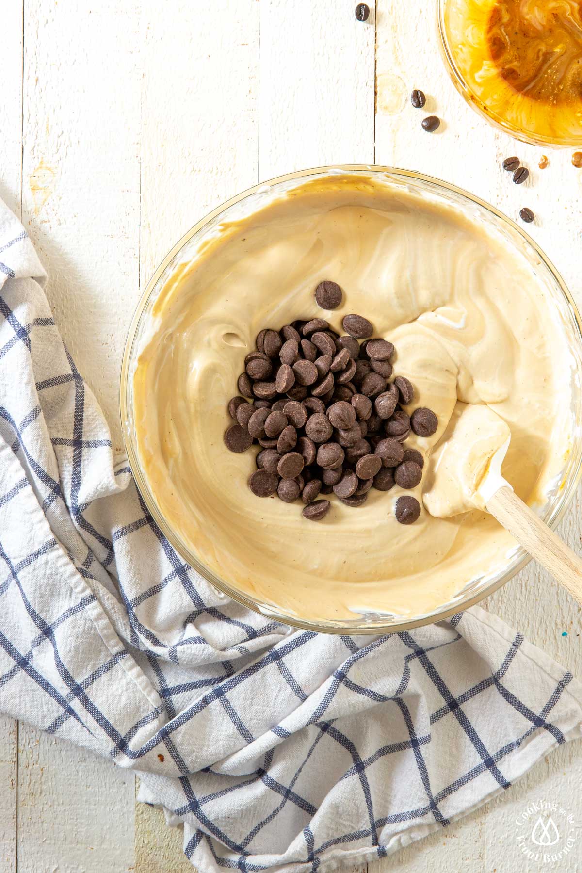 stirring chocolate chips into ice cream mixture