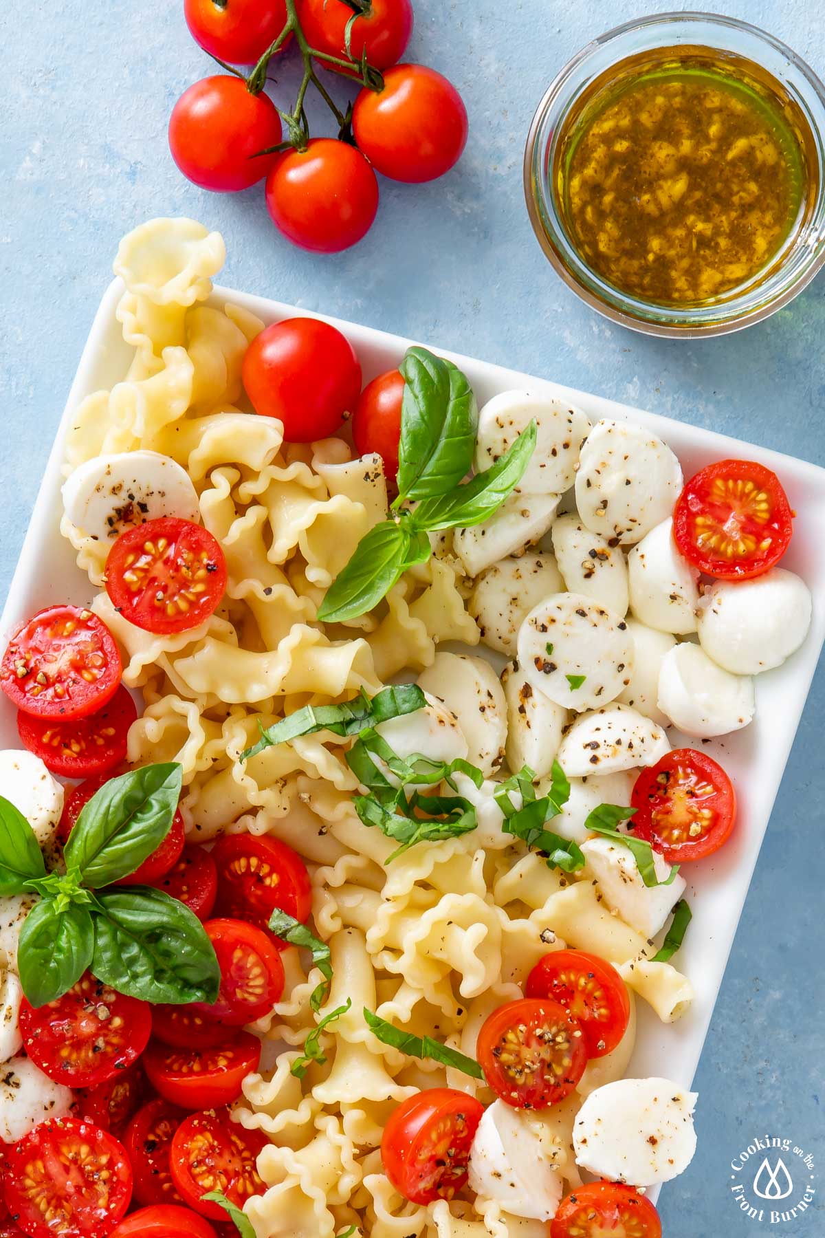 close shot of caprese salad on a white platter