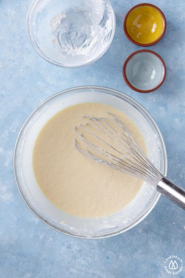 smooth crepe batter in a clear bowl