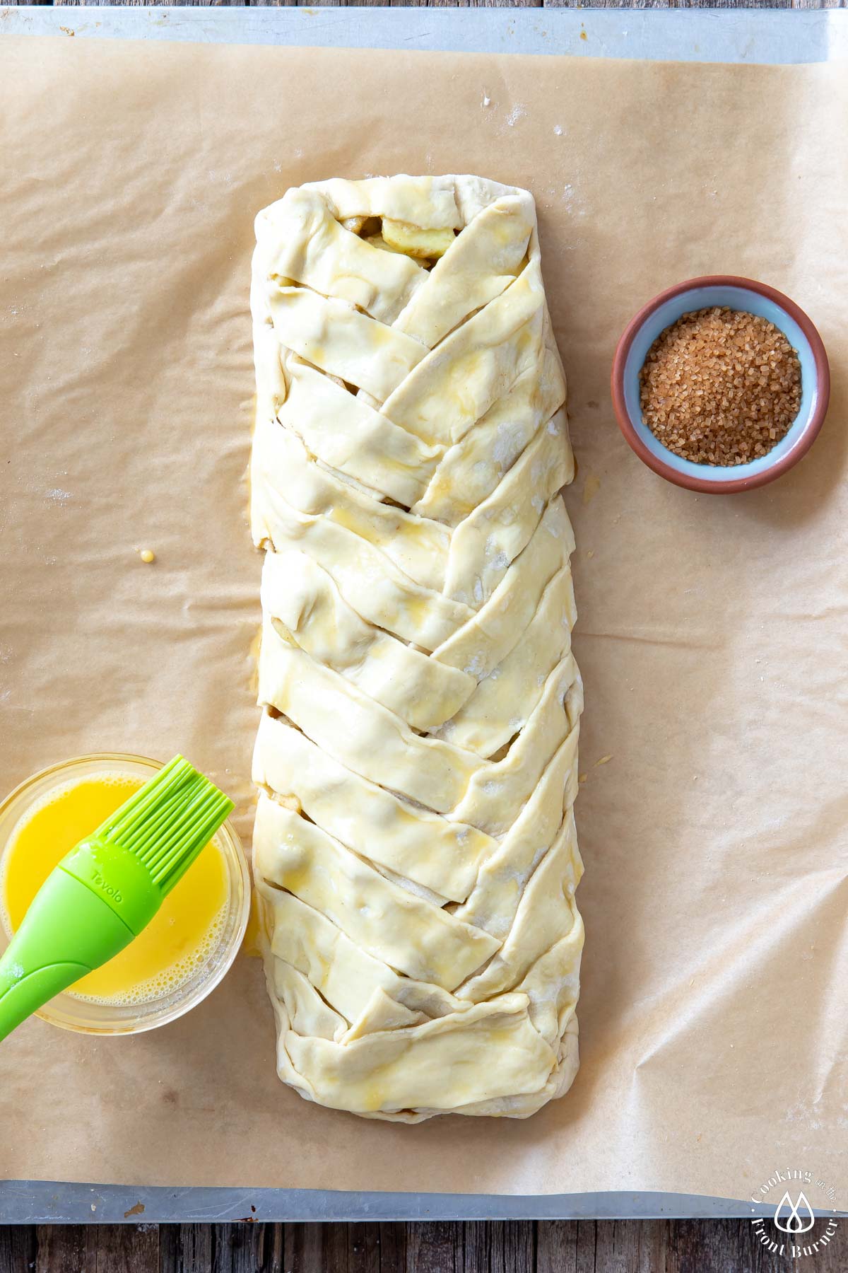 braided puff pastry on parchment paper
