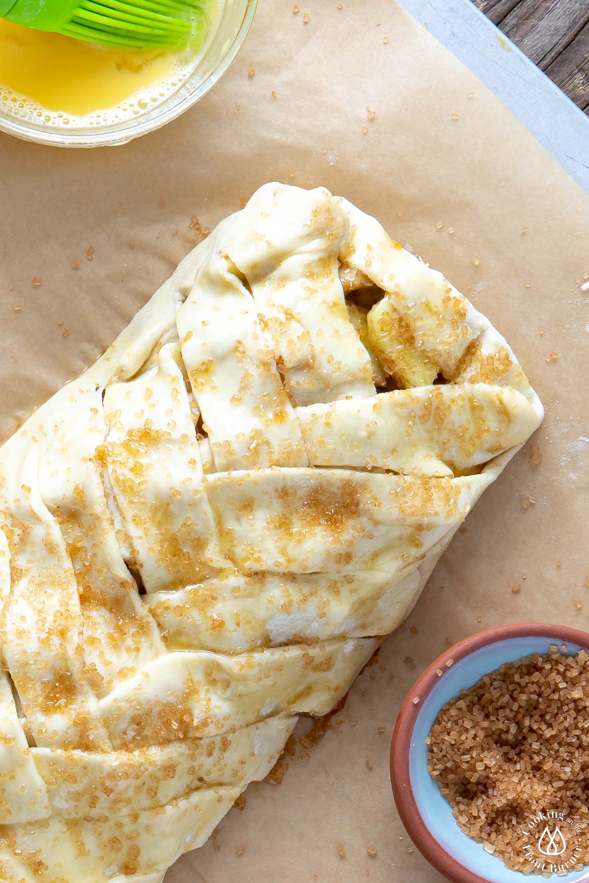 braided apple strudel with coarse sugar on top