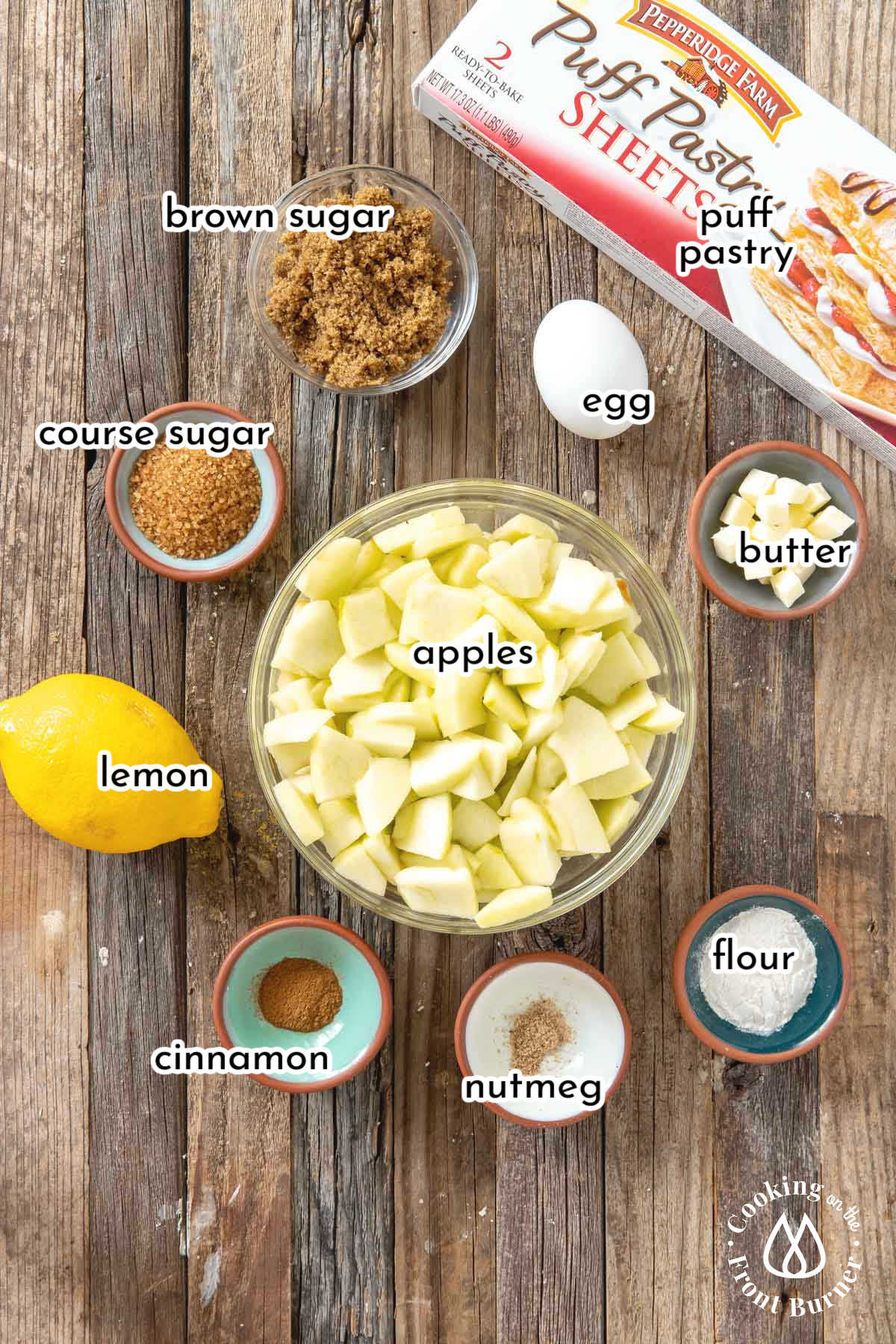 apple strudel ingredients in bowls on a wooden board