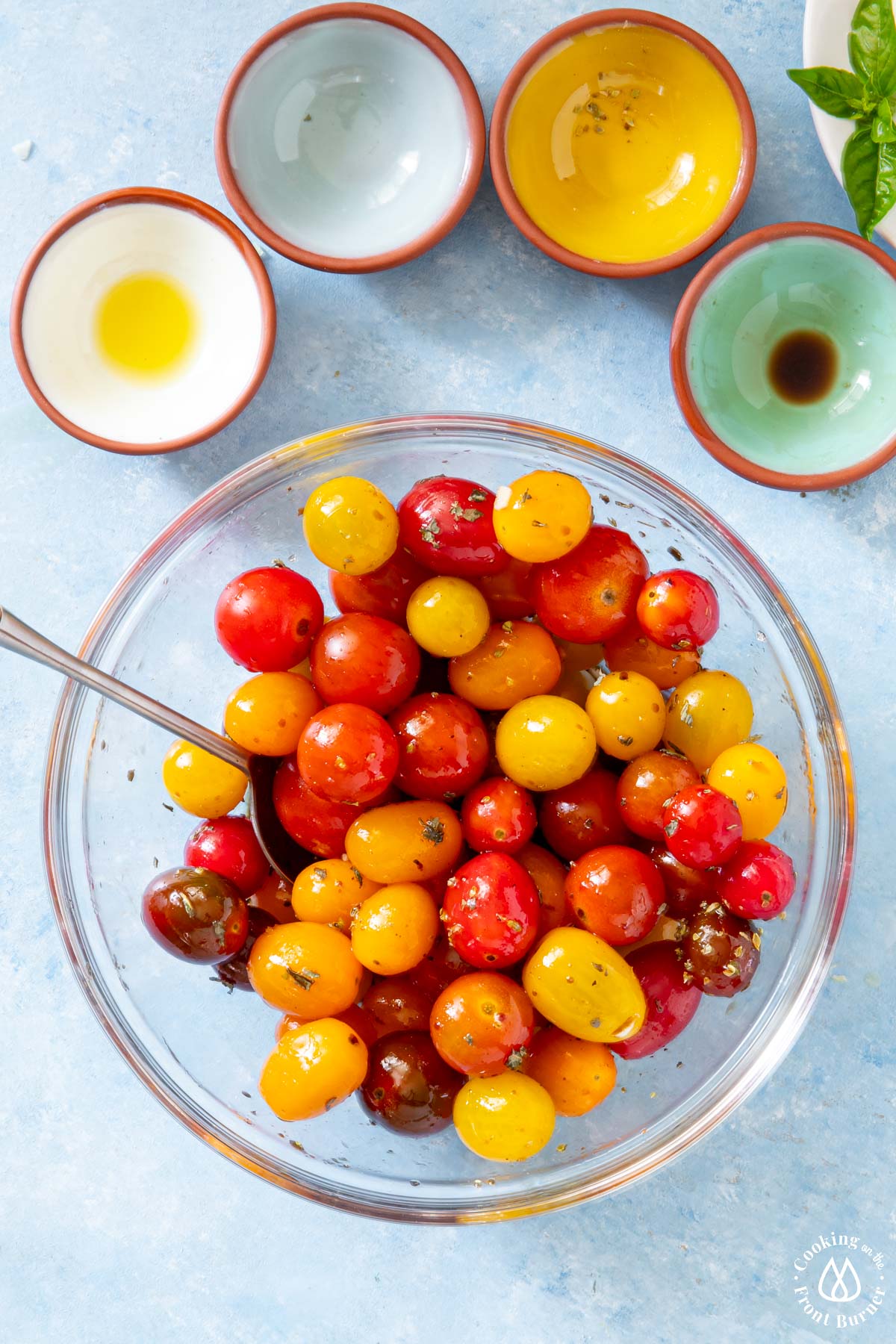 clear with colored tomatoes tossed with spices and olive oil