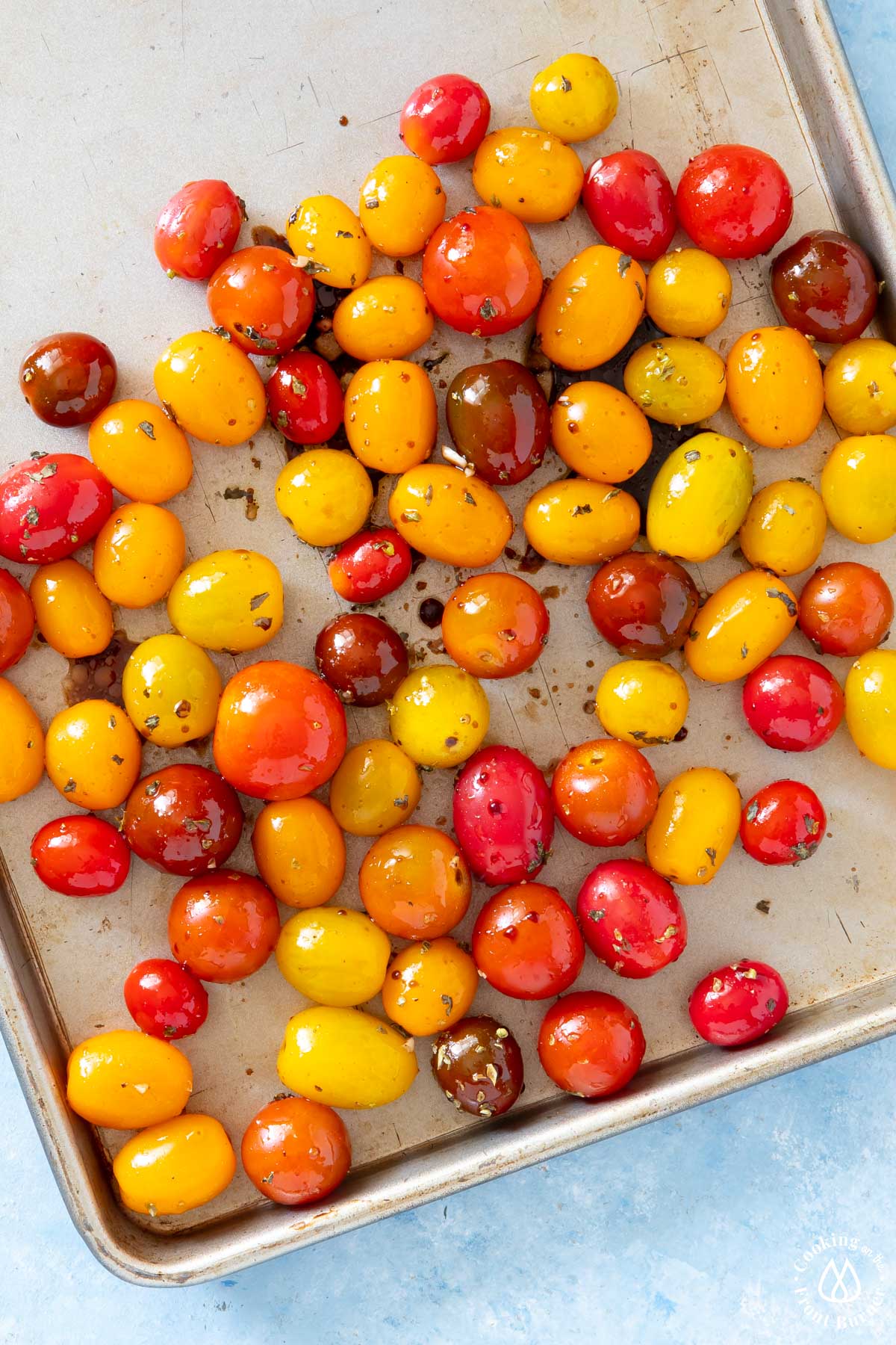 baking sheet with tomatoes and spices