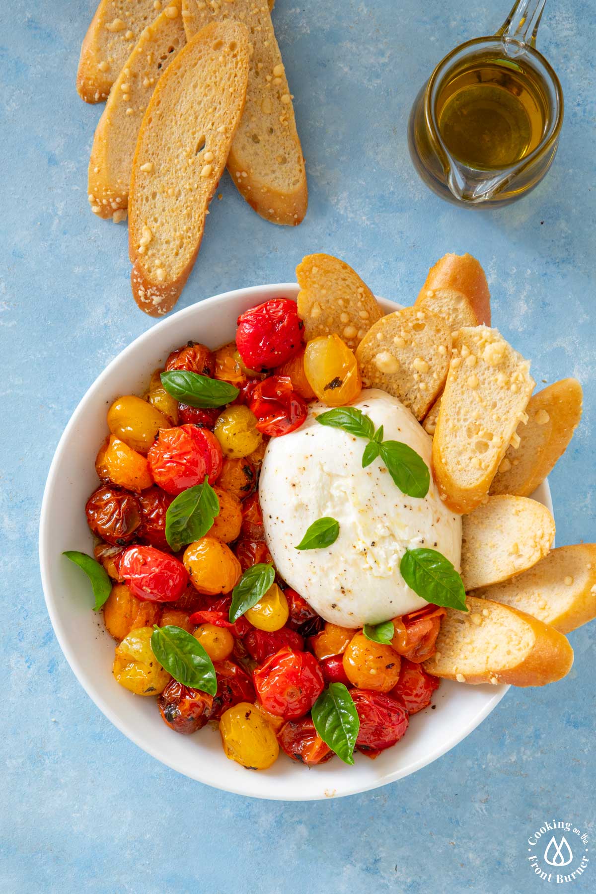 white bowl roasted tomatoes burrata