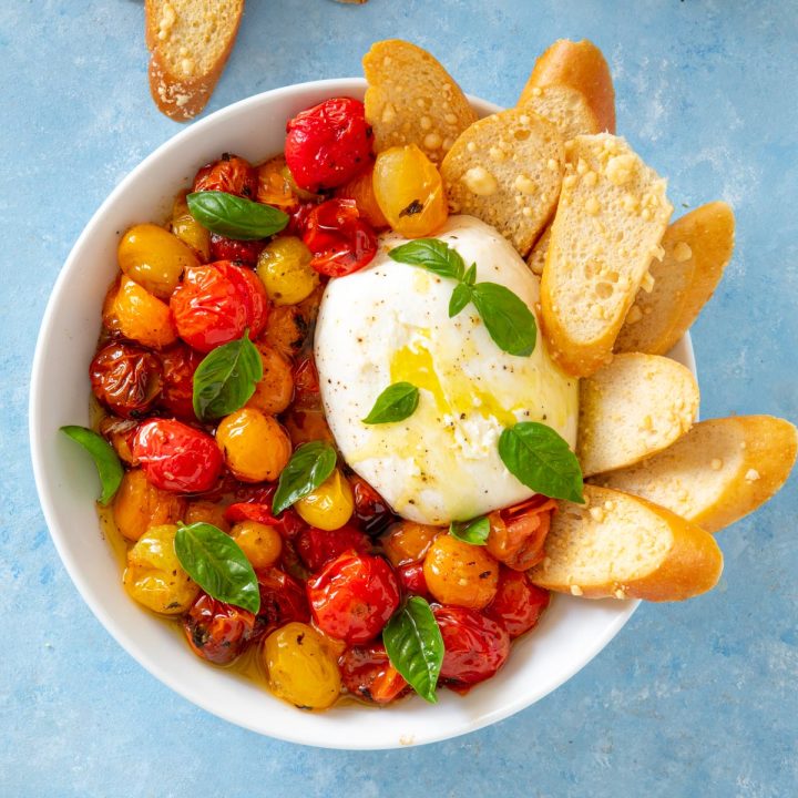 white bowl with burrata cheese and parmesan crisps